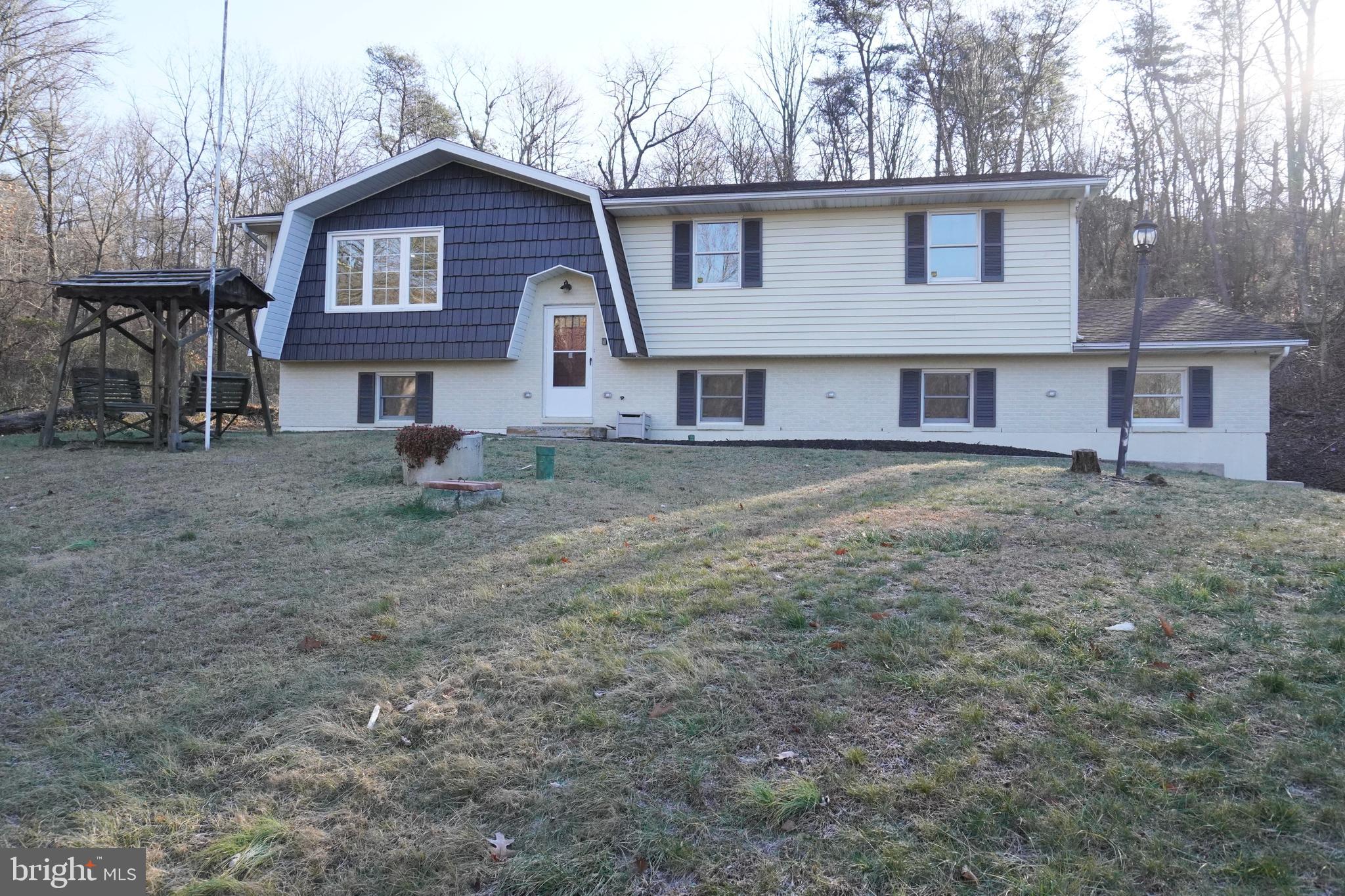 Welcome to 110 Mountain Ave, a split level home newly renovated. Sitting on a big lot with lots of privacy. Surrounded by 4.54 acres you have privacy and a big front yard with a shed. Brand new garage doors with freshly painted trim around them. Inside you will notice the new stunning renovations. On the main level you will find an open concept with all brand new floors. A Kitchen with Brand new Countertops, freshly painted cabinets, new sink, and brand new doors that lead out to the deck. On the same floor you will find a bathroom with brand new tile and all new features. A new sink, shower and toilet also. The main floor also has three bedrooms with fresh paint and brand new carpets. Downstairs on the lower level there is an additional bedroom that has brand new paint and carpet. Also on the bottom level there is an open main room with a brand new wooden fireplace and the same brand new vinyl flooring found on the upper level. There is also a half bath with brand new sink and toilet. The lower level leads out to the two door garage. Don't miss out on the chance to make this newly renovated private home your own.