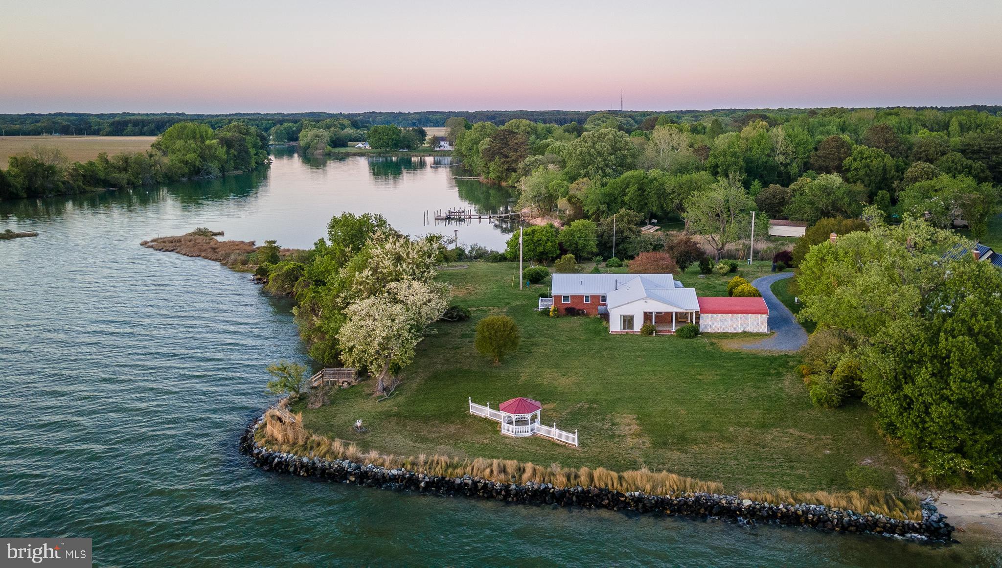 Enjoy panoramic sunset views with waterfrontage on both the Potomac River and Calvert Creek. Lovingly owned by the original local family for over 50 years, this solid all-brick home offers timeless charm with replacement windows and a durable metal roof.

The spacious, functional kitchen features abundant cabinetry, making it ideal for preparing meals and hosting family gatherings. Situated on 2 private acres, the property boasts approximately 200 feet of riprap shoreline on the Potomac River and more than 800 feet of frontage on Calvert Creek.

This exceptional waterfront setting provides convenient access to nearby restaurants and marinas by both boat and car. Spend your days boating, crabbing, oyster harvesting, and fishing right from your own property while taking in the incredible waterfront views and sunsets.