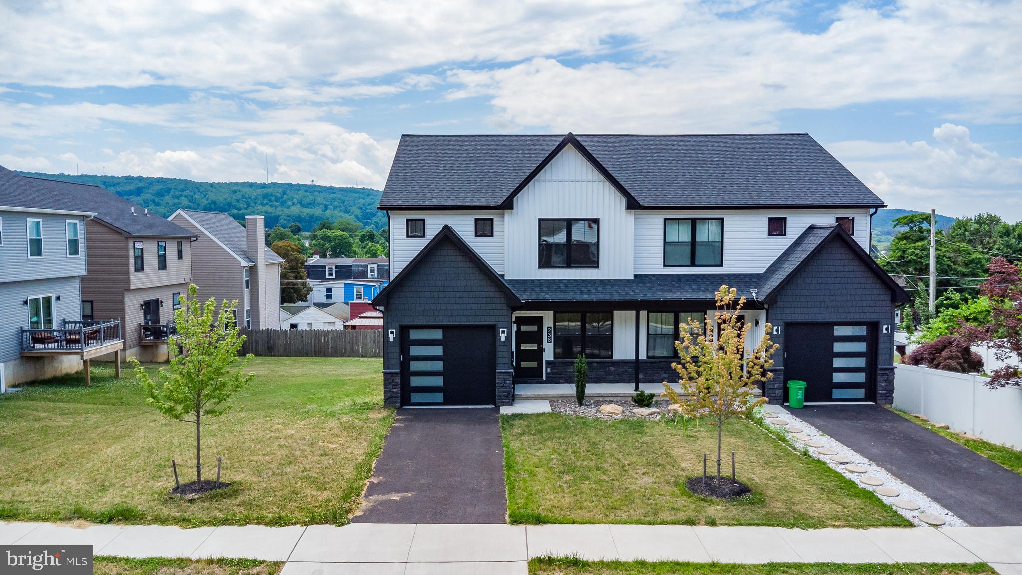 Exceptional 3-bedroom, 2.5-bath twin Colonial in South Allentown offering modern style, quality craftsmanship, and cutting-edge smart home technology. Built just three years ago and never occupied, this home provides the rare opportunity to own a like-new property without the wait of new construction. From the moment you arrive, you'll appreciate the impressive curb appeal featuring contemporary front and garage doors, attractive stone veneer accents, and premium two-tone siding. Inside, the thoughtfully designed floor plan showcases luxury vinyl plank flooring throughout the main level, abundant natural light, and stylish finishes at every turn. The beautifully appointed kitchen is designed for both everyday living and entertaining, offering a spacious center island, quartz countertops, tile backsplash, pendant lighting, large pantry, ample cabinetry, and stainless-steel appliances. The adjacent dining area opens to a rear deck, creating the perfect space for indoor-outdoor gatherings. Upstairs, the spacious primary suite features a private ensuite bath and an oversized walk-in closet. A conveniently located second-floor laundry room with utility sink eliminates the need to carry laundry between floors. Two additional generously sized bedrooms, a full hall bath, and linen closet complete the second level. The daylight basement offers excellent natural light and endless possibilities for future finished living space. Additional features include an attached one-car garage equipped with a Tesla Universal electric vehicle charger and smart garage door opener. Designed with today's homeowner in mind, this property offers an impressive collection of integrated technology features, including app-controlled lighting, thermostat, microwave, front door lock, and garage door opener. Exterior security cameras and automated dusk-to-dawn lighting provide added convenience and security, while the included robotic lawn mower helps keep the yard looking its best with minimal effort. Energy-efficient systems include a heat pump with central air and more than 30 LED recessed lights throughout the home. Combining modern technology, quality construction, and thoughtful design, this move-in-ready home truly stands out from the rest.