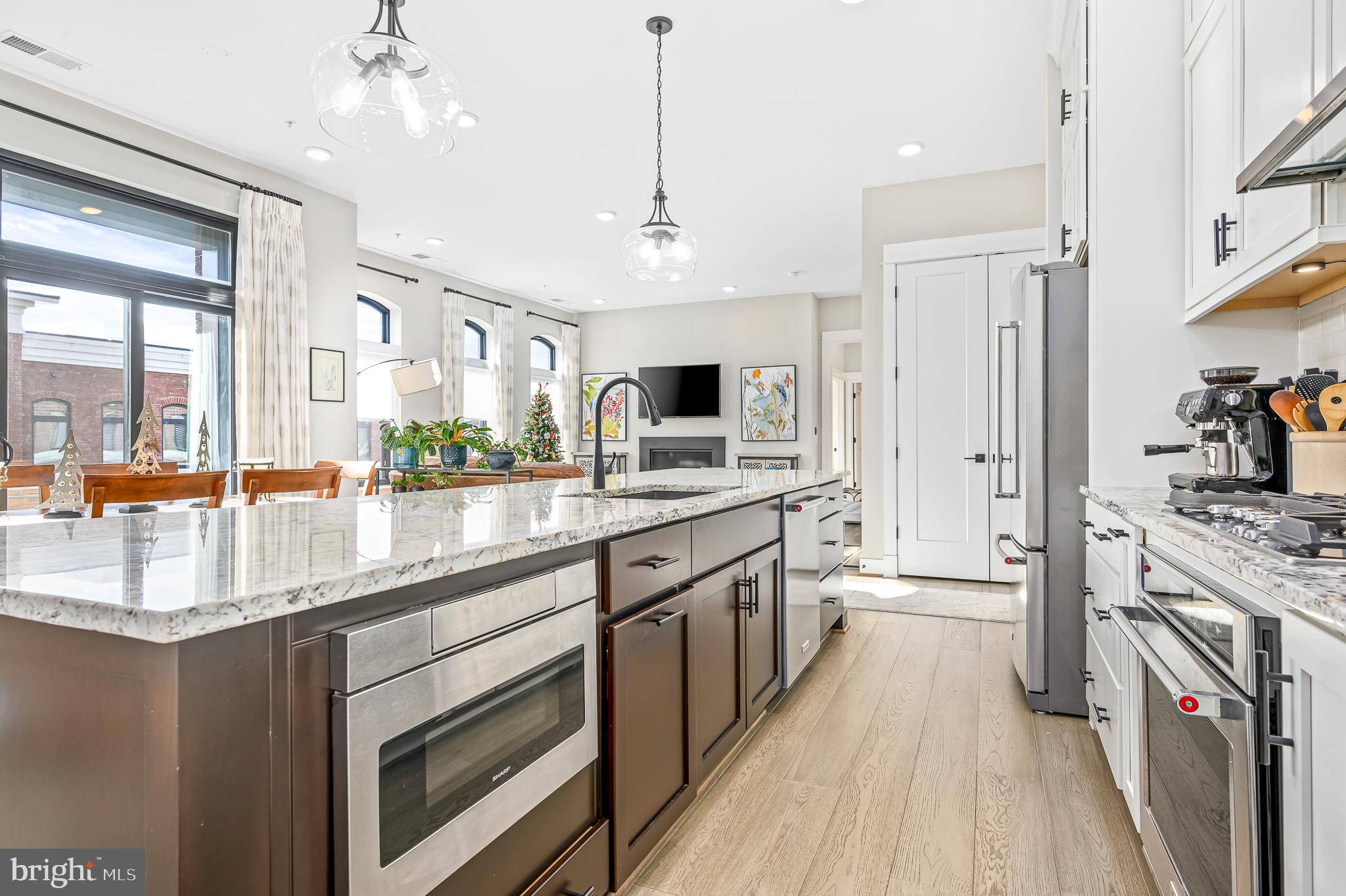 Welcome to luxury living in the heart of downtown Leesburg! This exquisite top-floor condo, nestled in a charming garden-style building, offers the epitome of sophistication and comfort. Boasting a private 1-car garage (#G8) and an additional driveway parking space, convenience meets elegance in this urban oasis.

Key Features:

Location: Situated in downtown Leesburg, this condo provides a prime address for those who crave the vibrancy of city living. Explore the eclectic mix of restaurants, parks, and events—all within walking distance. Enjoy urban living with a small town atmosphere.

Top Floor Elegance: Enjoy the privilege of residing on the top floor, where panoramic views and the serenity of the surroundings create a truly elevated living experience. Step out onto the outdoor balcony and savor moments of tranquility or entertain with style .

Gourmet Kitchen: The heart of this home is undoubtedly the gourmet kitchen. Discover culinary delights with the extra-large granite island, perfect for both casual dining and entertaining guests. The kitchen is equipped with top-of-the-line appliances and exudes a sense of timeless elegance.

Interior Sophistication: The condo features 2 bedrooms, a spacious den  and 2 baths, and designer touches throughout. A fireplace adds warmth and charm to the living space, while custom closets ensure ample storage. The upgraded Ecobee Thermostat and tankless hot water heater enhance energy efficiency and modern living.  A great place to work from home as seller has installed ethernet in living room and den for ease of internet access.  

Custom Details: From custom window coverings to meticulously crafted finishes, every detail has been carefully curated to create an atmosphere of luxury and sophistication.

This is more than a home; it's a lifestyle. Don't miss the opportunity to make this luxury condo your own and experience the best of downtown living in Leesburg.   Schedule a viewing today and embrace a new chapter of elegance and convenience.
