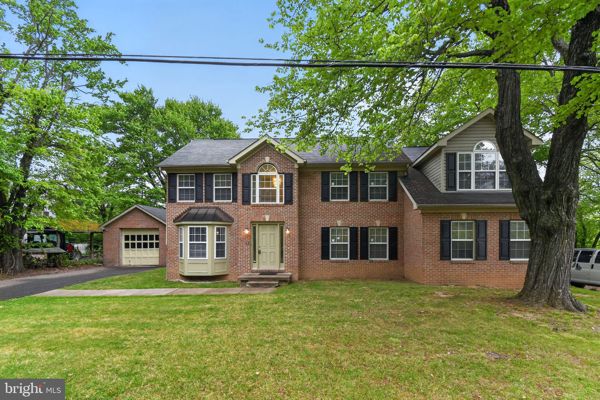 Welcome to this beautifully maintained and thoughtfully designed 3-bedroom, 2.5-bath home offering an impressive blend of comfort, privacy, and upscale features throughout.

From the moment you enter the dramatic two-story foyer, you are greeted with a bright, open feel and an inviting layout. Soaring vaulted ceilings in the great room enhance the sense of space, complemented by abundant natural light and excellent airflow. Comfort is elevated throughout the home with ceiling fans thoughtfully placed for year-round efficiency and comfort—featuring 2 in the great room, 2 in the family room, 1 in each secondary bedroom, and 2 in the primary suite.

A built-in wired speaker system runs throughout the great room and family room, creating the perfect setting for entertaining or relaxing at home.

The main level offers both formal and casual living with a spacious living room, elegant dining room, and a dedicated office space. The eat-in kitchen includes a gas stove, new dishwasher, updated sink with garbage disposal, tile flooring, pantry, and sliding doors that open to a private backyard—ideal for indoor-outdoor living.

The inviting kitchen features a wet bar with new cabinetry and a beverage fridge/wine cooler, making it an ideal space for entertaining.

Upstairs, convenience meets functionality with a second-floor laundry area located just steps from all bedrooms. The primary suite serves as a true retreat with its own private staircase, spacious sitting area, and flexible layout that could allow for a fourth-bedroom conversion if desired. The ensuite bath showcases elevated finishes, including leathered countertops and quality craftsmanship throughout.

Additional highlights include crown molding throughout, a fully functional intercom system, and dual heating and cooling systems for optimal comfort. Two pellet stoves add warmth and charm in cooler months.

The exterior offers durable brick and vinyl siding, a flat and usable backyard, and an oversized one-car detached garage with attic storage for added convenience.

Tucked away in a private setting, this home combines thoughtful design, spacious living, and versatile functionality—offering a rare opportunity you won’t want to miss.