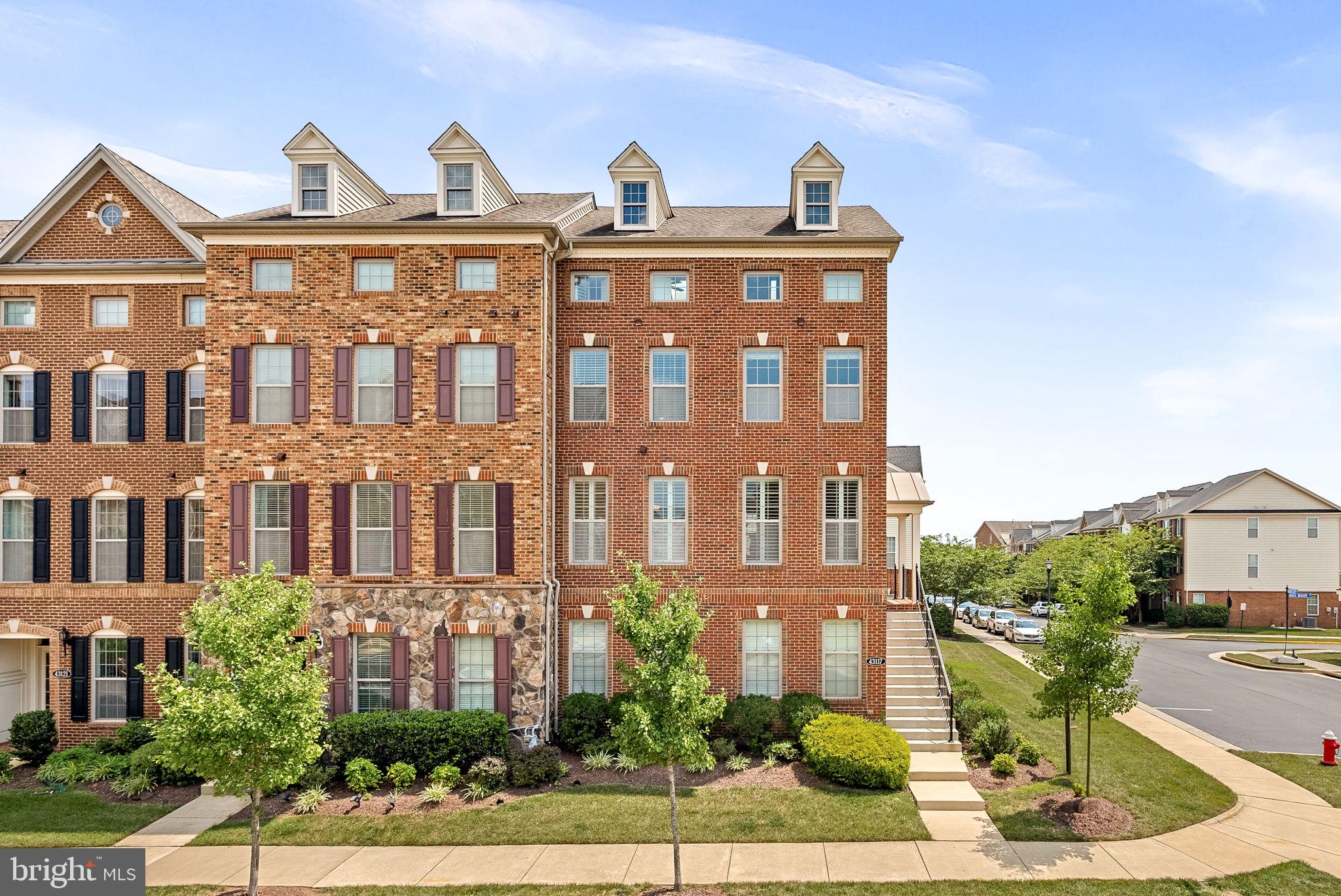 Welcome to this luxury end-unit townhome built by Toll Brothers, perfectly positioned with park views and timeless curb appeal, located in the sought-after Moorefield Station.

Featuring elegant brick on two sides, this beautifully maintained home offers over four levels of bright, inviting living space—freshly updated in 2025 with new carpet, interior paint, and a freshly painted front door.

Step inside to the main level, where natural light pours through expansive windows adorned with custom plantation shutters. The open-concept layout features a gourmet eat in kitchen with granite countertops, and stainless steel appliances. The adjoining dining area and family room, complete with a  gas fireplace. Just off the kitchen, a low-maintenance composite deck awaits - perfect for entertaining.

Upstairs, the third level boasts a luxurious primary suite with a generous walk-in closet and en-suite bath. Two additional bedrooms share a hall bathroom, and a conveniently located laundry area.

The top-floor bonus space is a true retreat—flooded with light from skylights and equipped with two ceiling fans, it's perfect for a home office, gym, playroom, or media lounge.

On the entry level, you’ll find a private flex room with recessed lighting and large windows—ideal for a guest suite, home office, or studio—along with a full bath and coat closet. From here, access the attached two-car garage with extra room for storage or a workbench.

The Moorefield Station Community offers fantastic amenities, including a community pool, fitness facility, parks, basketball courts, trash, lawn care, and more. Additionally, the community is located about 1.5 miles from the Ashburn Metro Station, as well as convenient to route 267, making it a commuter's dream!

Don't miss this rare end-unit opportunity offering luxury, space, and a prime location in a sought-after community.