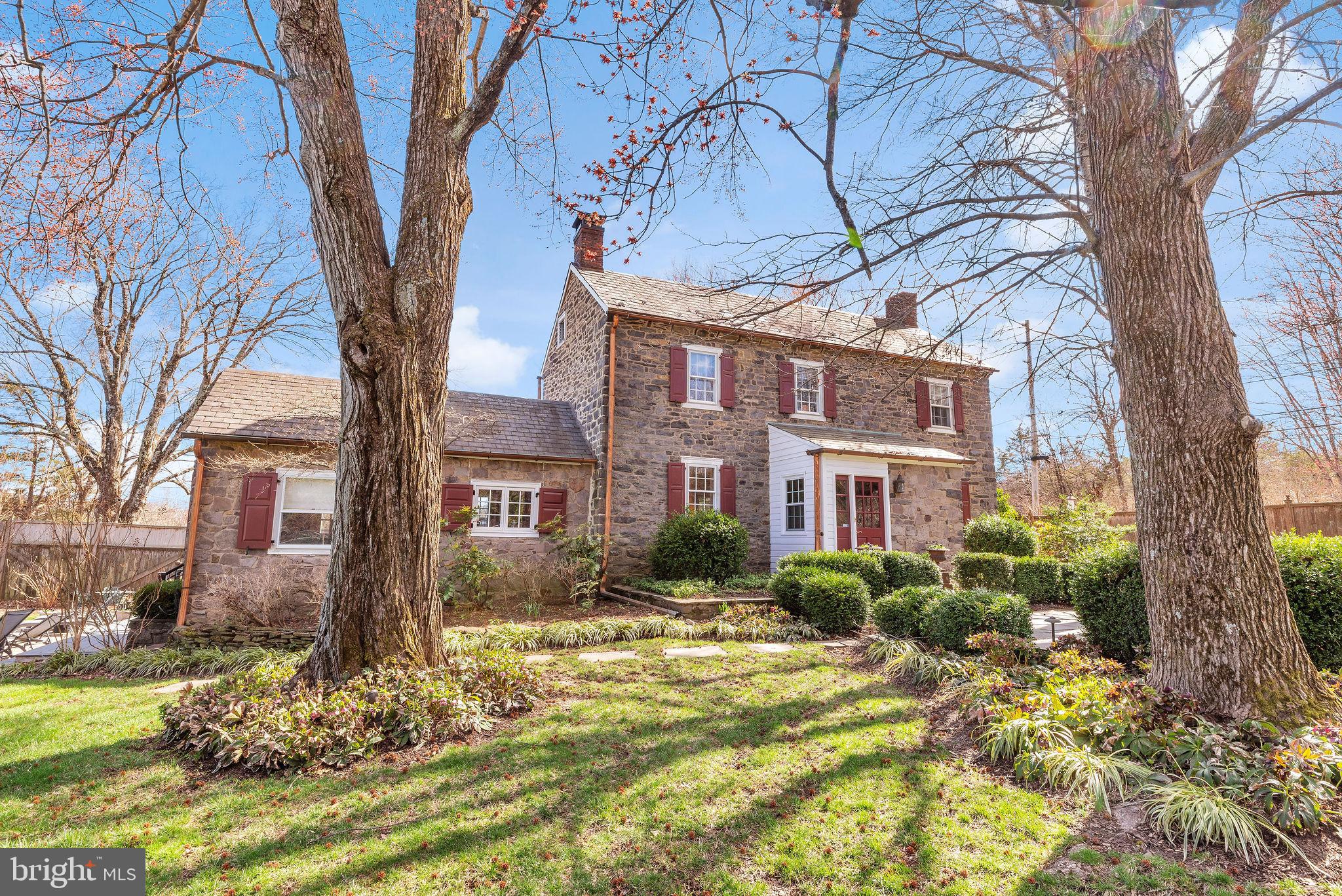 Welcome to a storybook retreat where elegance meets timeless charm! Enter this beautifully landscaped 2.5-acre property through iron gates to find an enchanting fieldstone home, paired with two delightful guest cottages, offering a serene lifestyle surrounded by nature.

The main home is steeped in character, from the blue stone sidewalk leading to the inviting vestibule entrance to its cottage-like details throughout. Inside, the living room exudes warmth with a beamed ceiling, a stunning Mercer tile fireplace, built-in bookshelves, and rich hardwood floors. With three walls of paned glass windows, the dining room and sitting room are bathed in light. The eat-in kitchen blends charm and functionality with exposed fieldstone accents and custom cabinetry. A cozy powder room with classic wood paneling rounds out the main level. Upstairs, winding pie stairs lead to the owners' suite featuring a vaulted ceilinged primary bedroom with glass-paneled closets and a flexible second bedroom is currently used as a home office. A renovated bath with a frameless glass shower and radiant heated floors adds a modern touch.

Additionally, two guest cottages (each approximately 350sf) offer versatility, complete with cozy living areas, full baths, and unique details -- with one offering a kitchenette, 1-car oversized garage and 2 horse stalls. The other has a separate bedroom and the laundry. Outdoors, a large, low-maintenance deck overlooks a sparkling 52’x17’ swimming pool, the 1-acre+ horse paddock and the river valley beyond. Cap it all off with a hot tub, shaded garden with its original “wishing” well and a decorative stone accent wall with wood-burning fireplace by the pool to make for spectacular blend of relaxation and entertaining.

Additional amenities: Central Air, Crestron sound system, copper gutters and downspouts, and a digital lighting system. Make this captivating oasis your next home or weekend getaway!
