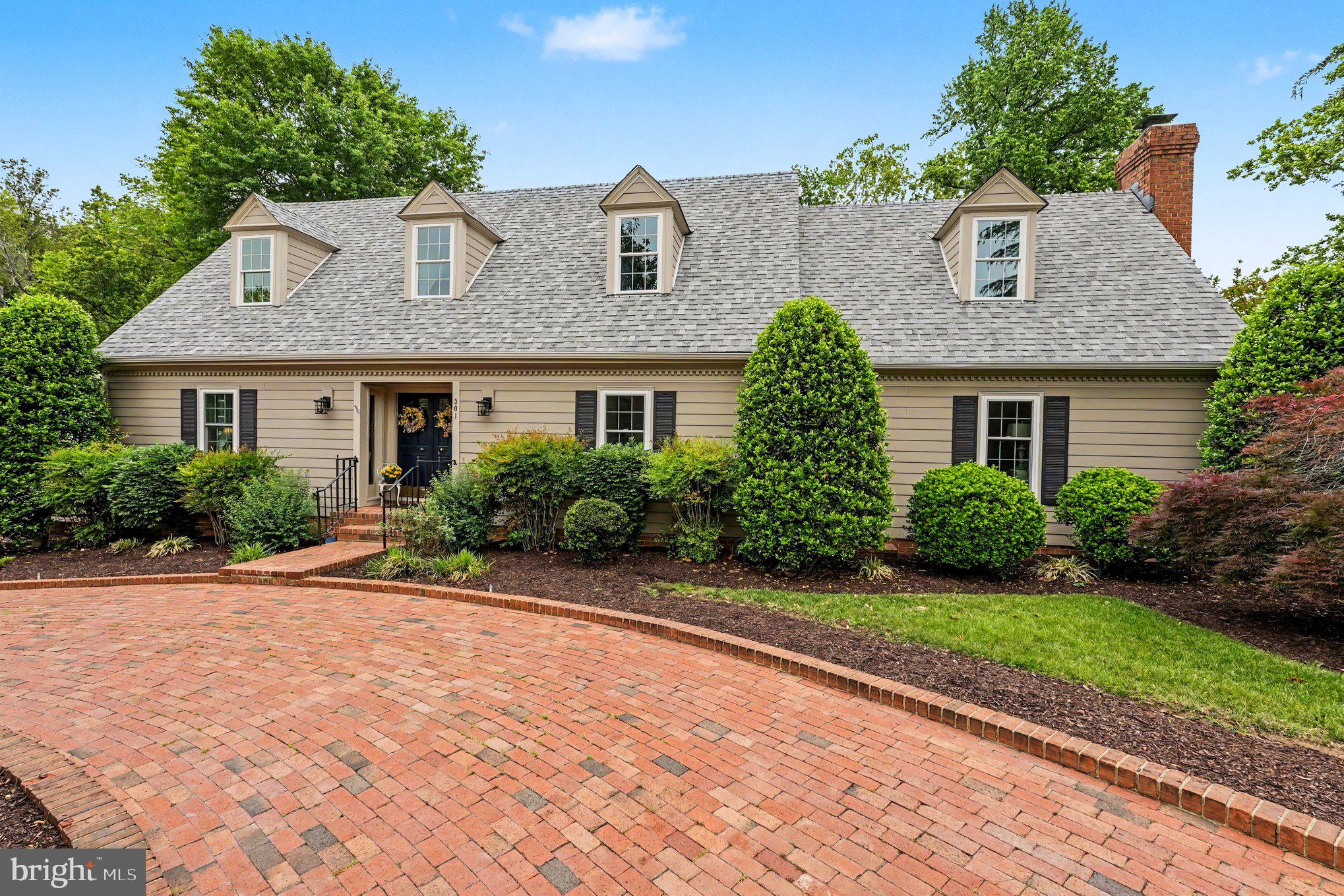 If you’ve been searching for a truly one-of-a-kind property in the City of Fredericksburg, your
search ends here.

This beautifully updated Cape Cod home is nestled in the well-established Westwood
community and sits on two lots backing to peaceful wooded areas, offering both privacy and
charm.

From the moment you arrive, you’re welcomed by a circular brick driveway, mature magnolia
trees, and lush landscaping filled with vibrant flower beds and established plantings. A privacy
fence enhances the serene outdoor setting.

The backyard is an entertainer’s dream—featuring an in-ground pool, expansive patio, brick
BBQ area, gazebo, and multiple covered and open-air spaces perfect for dining, relaxing, and
hosting gatherings.

Inside, the home blends timeless elegance with modern updates. The grand entry foyer
showcases a vaulted ceiling and curved staircase, flanked by a cozy reading nook and a spacious
formal living room adorned with hardwood floors, crown molding, and chair rail detailing.

At the heart of the home is a fully renovated modern kitchen, seamlessly connected to a dining
area with a wood-burning fireplace. Just beyond, the stunning sunroom offers 180-degree views
of the backyard oasis, complete with vaulted ceilings and exposed wood beams.

The main-level primary suite is a private retreat, featuring a gas fireplace, access to a secluded
patio, and a luxurious en-suite bath with double vanities, a walk-in shower, and a classic
clawfoot tub. Additional main-level spaces include a home office, half bath, and laundry area.

Upstairs, you’ll find three bedrooms, a bonus room, and a beautifully renovated Jack-and-Jill
bathroom.

The walk-out lower level offers even more living space with a newly renovated den opening to
the pool area through an enclosed cabana. Additional features include a full bath, laundry
hookups, a two-car garage, and a workshop.

The detached carport includes enclosed storage and a versatile upper-level room—ideal for a
home office, gym, guest space, or studio.

A charming path leads to the fully renovated guest cottage, complete with its own bathroom and
kitchenette—perfect for visitors, multi-generational living, or potential rental income.

Recent updates provide peace of mind:
 New roof, HVAC, and hot water heater (2022)
 Exterior refurbishment and repainting (2023)
 Kitchen and upper-level bath renovation (2024)
 New windows (2025, excluding sunroom)

Conveniently located between Route 3, Plank Road, and Cowan Boulevard, you’re just minutes
from Mary Washington Hospital, downtown Fredericksburg, shopping, and dining.

This move-in ready home offers the perfect blend of comfort, luxury, and versatility—whether
you’re looking for a private retreat or the ultimate entertaining showplace.
