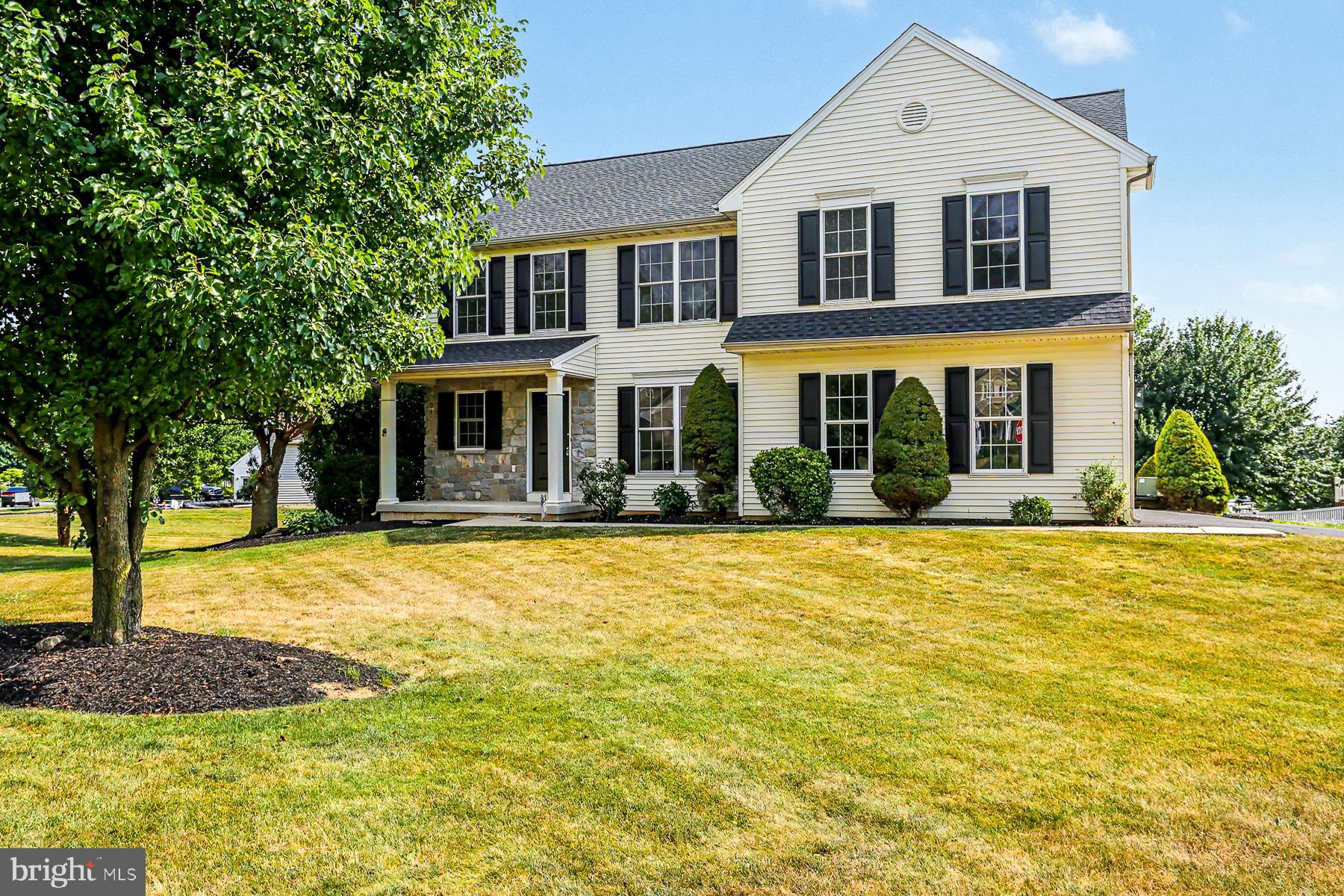 Nestled in a quiet neighborhood surrounded by scenic farmland, this move-in-ready 4-bedroom, 2.5-bath colonial offers nearly 2,600 square feet of above-grade living space and has been beautifully updated throughout. The main level features an open floor plan with new flooring, fresh paint, a spacious living room with a gas fireplace, and an updated kitchen complete with brand-new quartz countertops, tile backsplash, and new stainless steel range, microwave, and dishwasher. Step outside onto the large deck overlooking the expansive backyard—perfect for entertaining or relaxing. A side-entry garage, mudroom, and convenient first-floor laundry add everyday functionality. Upstairs, you'll find four generously sized bedrooms, including a spacious primary suite with a private bath and a newly tiled walk-in shower. A second-floor bonus living area offers flexible space for a family room, playroom, home office, or media room. Additional recent improvements include a brand-new roof and fresh landscaping, making this home truly turnkey. If you're looking for space and updates, this home is a must-see!