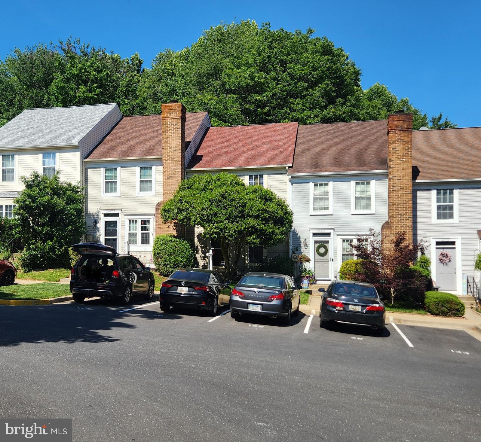 Lovely townhome tucked away in a quiet section of Waters Landing. The main floor features a spacious kitchen and a living/dining room combo with direct access to a private deck and wooded views.  There is also a convenient half bath off the entry foyer. Upstairs provides two large bedrooms both with double closets, one with direct access to a shared bath and the other with vaulted ceilings. The large full bath includes a soaking tub and separate walk-in shower. The finished lower level has a wood burning fireplace, laundry, rough in for a bathroom and plenty of storage space. Updates include new flooring, new kitchen appliances and fresh paint throughout. Easy parking including an assigned spot directly in front of the home and plenty of visitor parking. Virtual staging used on some photos.