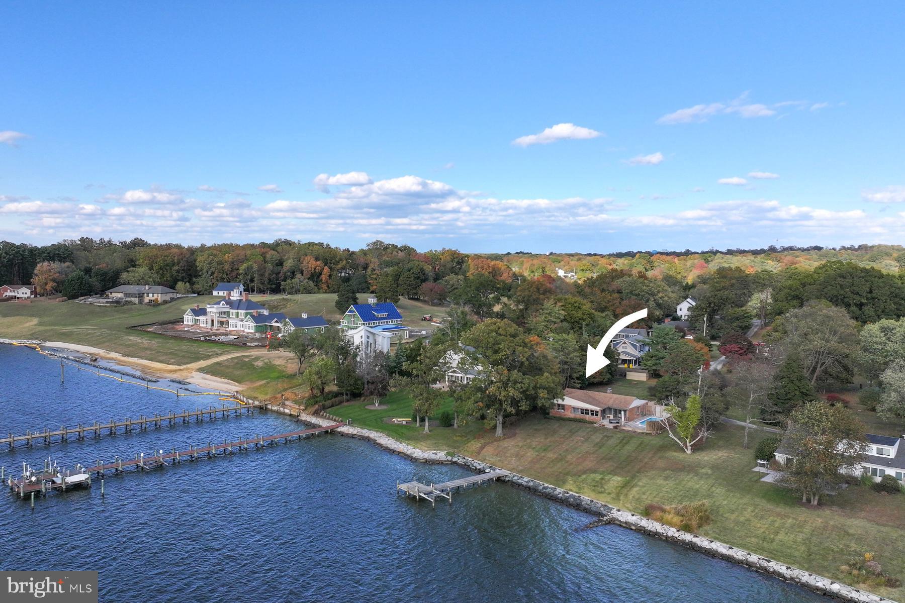 A rare, sunset orientation opportunity on the South River, 3258 Harness Creek Rd offers the perfect blend of waterfront privacy and amazing downsizing potential. The existing single-level residence on .63 acre features three bedrooms and two bathrooms, ideal for those looking for one-floor living. The gracious living room overlooks the pool, and the adjoining dining room opens onto the waterside deck. The kitchen and family room have expansive west-facing views out over the South River. This is an incredible opportunity to thoughtfully update within the current footprint or build new with limited expansion potential. The property has a beautiful waterside pool and 109 ft of rip-rapped waterfrontage, with private pier, on the South River. The home’s elevation is ideally located out of the flood zone yet the approach to your pier is a very gentle slope. Located just minutes from downtown Annapolis and Quiet Waters Park, this property is in an area of multi-million dollar homes and combines the tranquility of waterfront living with the convenience of in-town access.