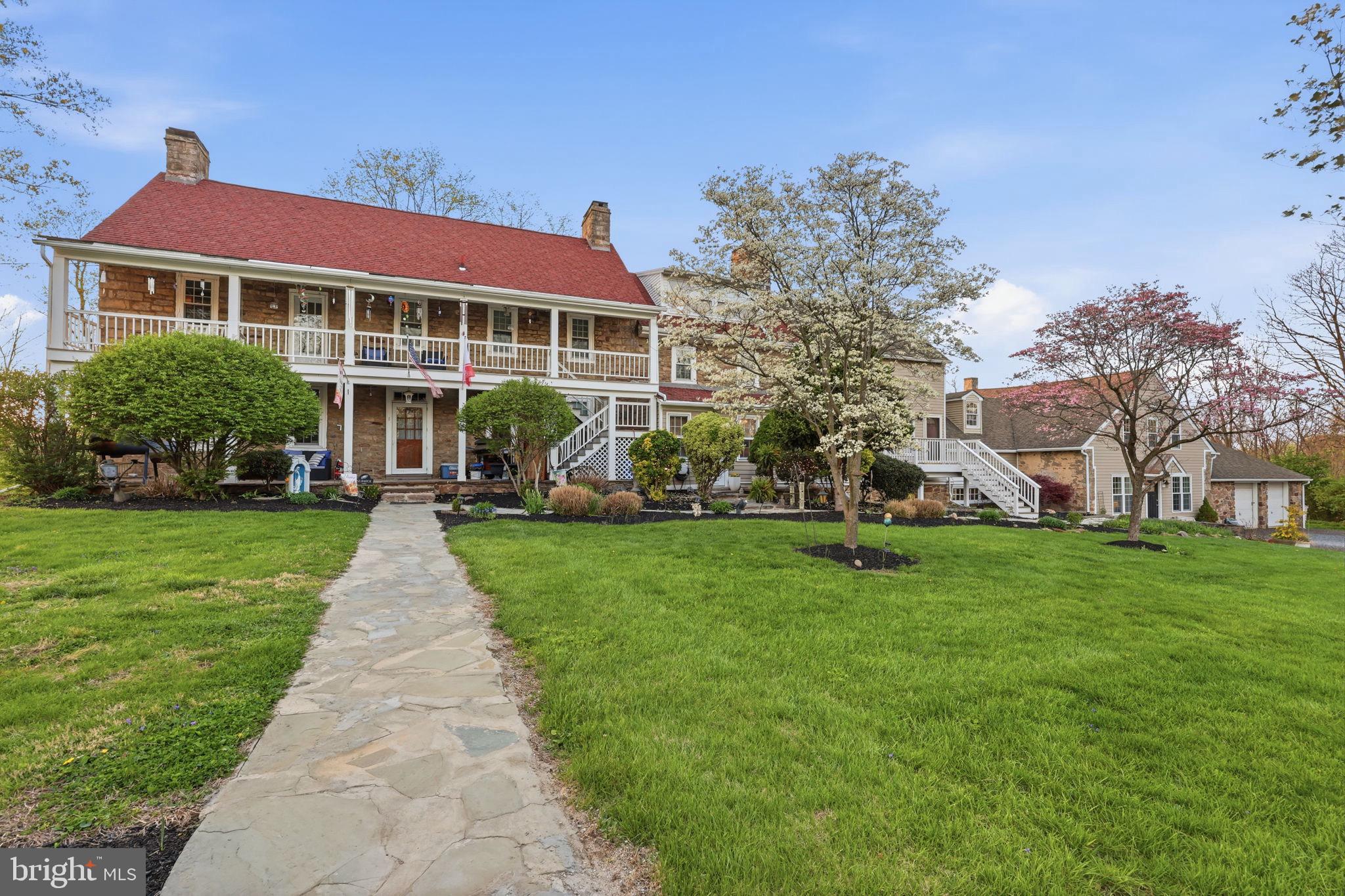 A rare opportunity to acquire a fully leased, character-rich Bucks County asset with immediate income and clear upside—ideal for both seasoned investors and lifestyle buyers seeking a hybrid investment.

This fully rented 5-unit farmhouse conversion is situated on nearly 6 acres in desirable Buckingham Township, offering immediate cash flow with strong upside potential. The property includes four units within the main farmhouse and a detached, carriage house (Unit 5), creating a diversified and stable income stream.

All units are generously sized and reflect sought-after Bucks County character. Unit 4 (former horse stable) and Unit 5 (carriage house) have been fully renovated, while three remaining units present value-add opportunities through future updates and rent optimization. Current rents are below market, with nearby comps supporting increased income opportunities.

At the current asking price of $1,595,000, the property delivers an approximate 6.5% in-place cap rate, offering investors a strong in-place return with compelling potential to elevate both income and long-term value.

Tenants pay all utilities except water, helping maintain low operating expenses. Additional income is generated through garage rentals, and a full basement provides valuable storage. The property also benefits from a newer septic system and ample on-site parking. Current, below market rents are:

$1950 (3 beds, 1.5 baths)
$1950 (3 beds, 2 baths)
$1750 (2 beds, 1.5 baths)
$1975 (1 bed, 1.5 baths)
$2870 (3 beds, 2.5 baths)

Located just minutes from Doylestown, New Hope, and major commuter routes, this is a rare opportunity to acquire a stabilized asset with both immediate income and long-term appreciation potential.

12 parking spots not including garages. Showings available late afternoons by appointment only with listing agent with 24-hour notice. Serious inquiries only.