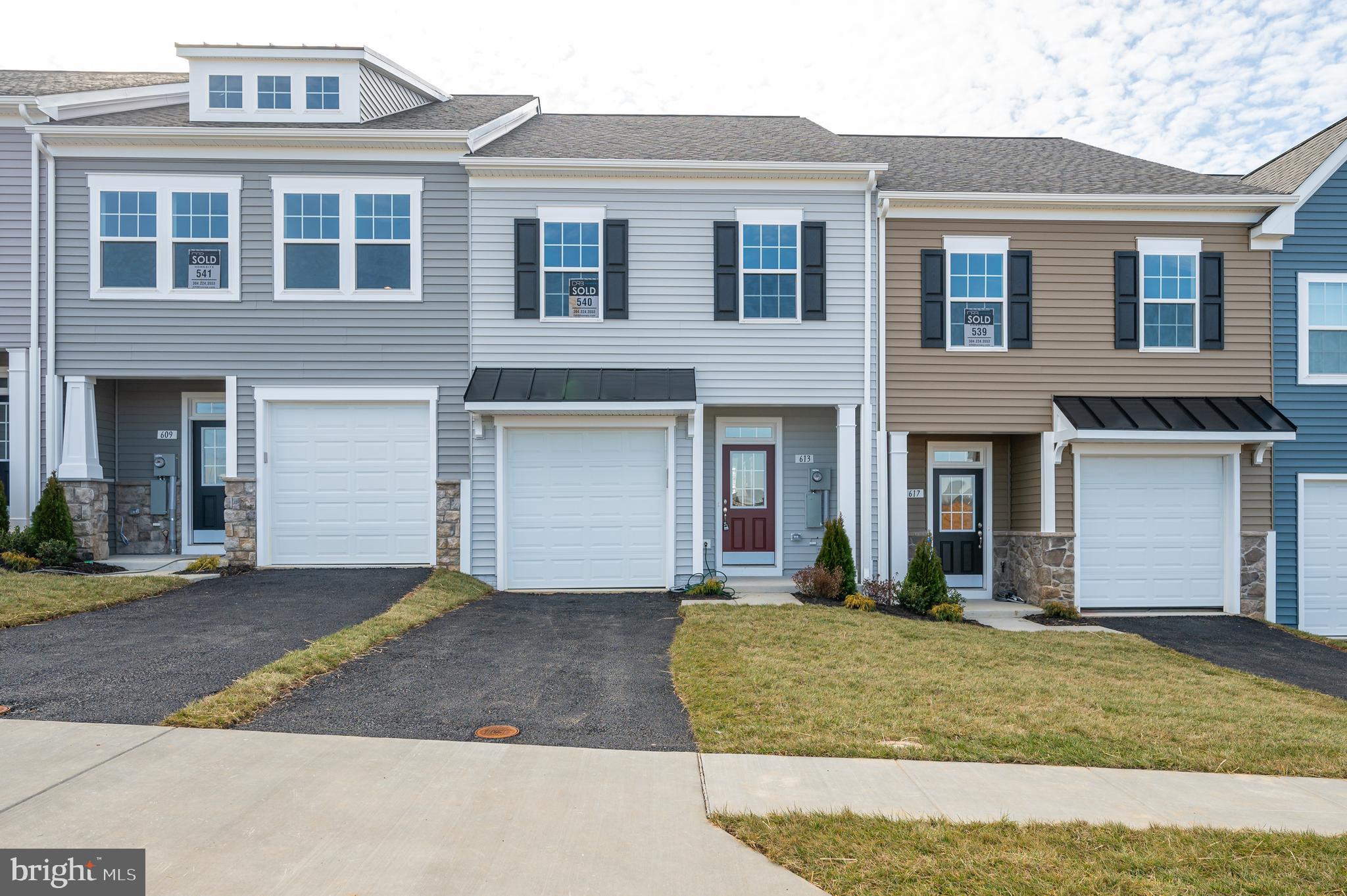 Discover luxury living in Berkeley County's premier planned community of Martinsburg Station! 605 Detroit Square is a stylish 2-level townhome featuring 3 bedrooms, 2.5 bathrooms, a covered front stoop, partial stone front, and 1-car garage. Enjoy high-end finishes like 9 ft. ceilings, a spacious kitchen with stainless appliances, white quartz countertops, and an open family room with access to a private oversized backyard patio. The primary suite boasts a large walk-in closet and private ensuite bathroom with dual vanities and a tiled shower with shower niche. Two additional secondary large bedrooms are also featured on the second level with a shared full hall bath. Laundry included and conveniently located off of the bedrooms. Enjoy community amenities like a clubhouse, pools, and walking trails with breathtaking mountain views. Embrace this opportunity for sophisticated, convenient living. Schedule a showing today and see if this is the home you've been searching for! Applicant(s) must be able to pass credit/background check. MINIMUM FICO CREDIT SCORE OF 650 REQUIRED FOR ALL ADULT APPLICANTS. No Smoking. No Pets.