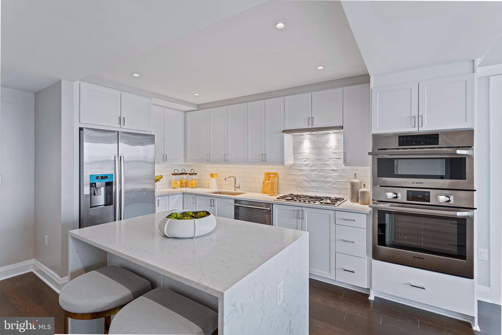 FINAL RELEASE/CLOSEOUT PRICING - BRAND NEW TWO-BEDROOM ONE BATH at Old Town's newest luxury condominium building, VENUE! Absolutely stunning in person, this is an incredible value for a 7th-floor two-bedroom with views of the Potomac River and Washington Capital! Built by renowned local developer, Carr Companies, the finishes in this building are extraordinary. Chef's kitchens feature Bosch appliance packages, Quartz countertops, and custom soft close cabinetry. This particular floor plan was designed to utilize every inch with purpose, so it lives larger than 922 sq ft! The owner's bath features a vanity and walk-in shower with a 5-point showerhead and detachable nozzle. A total of 4 closets allow for ample storage including two closets in the owner's suite (w/ a MASSIVE walk-in), a reach-in in the guest bedroom, along with a closet in the foyer. VENUE offers a turn-key elevated lifestyle. Enter through the hotel-style Porte-Cochere into our Grand Lobby, where you will be met by our Full Service Concierge and on-site building manager to assist with your every need. The building features a sprawling Rooftop Terrace offering expansive panoramic views of the DC Monuments, Potomac River, and Old Town skyline as well as an outdoor grilling station and fire pit seating area. The elegant indoor Owner's Sky Lounge is equipped with flat-screen TVs, a fireplace, and a cocktail bar, perfect for entertaining! Relieve your stress in the State-of-the-art Fitness center complete with a Barre studio. VENUE is the ideal location in Old Town's most desirable neighborhood, right in the center of entertainment, restaurants, and shopping, with direct access to the Mount Vernon Trail. This is a MUST SEE TWO BEDROOM!! Immediate occupancy is available. Come see what all the fuss is about!