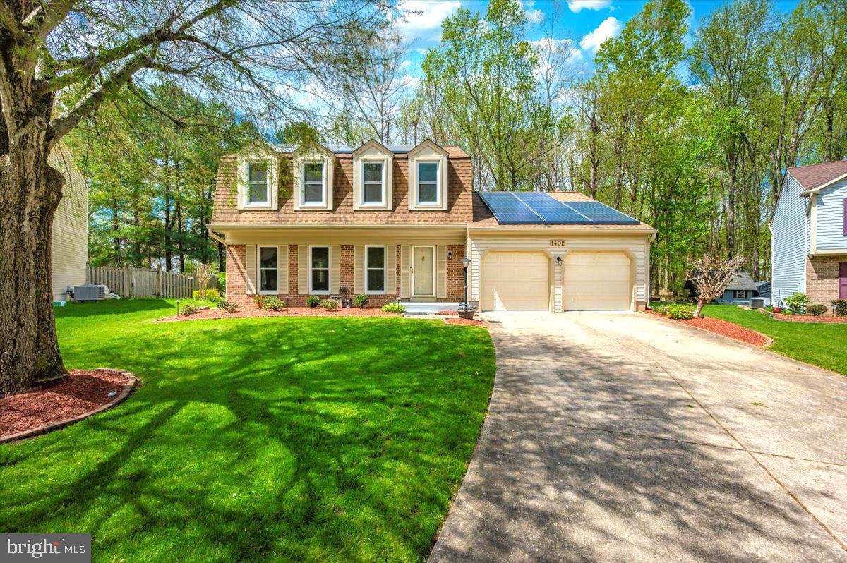This colonial home is situated on a private cul-de-sac in the highly sought-after Tall Oaks Crossing community. The kitchen features granite countertops, stainless steel appliances, and an eat-in area. The kitchen and family room both lead out to a large deck, perfect for barbecues and entertaining. Skylights in the family room bring in an abundance of natural light, while a cozy gas fireplace provides warmth during the colder months.

The formal dining room offers ample space for a large dining table and is adjacent to the living room, which is perfect for spending quality time with family and friends. Upstairs, the primary suite boasts a large walk-in closet, and the ensuite bathroom is complete with a newly updated ceramic walk-in shower. The windows in the upper level are dormer-style, providing a cozy nook for sitting and enjoying the view. Just down the hall, you’ll find two additional bedrooms and another full bathroom.

The fully finished basement offers additional space for entertaining or could serve as an in-home office. There is a rear entrance with walk-up steps leading to the backyard. The house is equipped with solar panels that are available for lease, providing an opportunity to save on electricity bills. The backyard is beautifully landscaped and backs up to a common area with a tot lot, and an underground sprinkler system helps maintain the yard with ease.

The neighborhood offers walking trails, playgrounds, and tennis courts. Conveniently located near shopping, restaurants, and plenty of sports and community activities, this home is perfect for those seeking both comfort and convenience.
