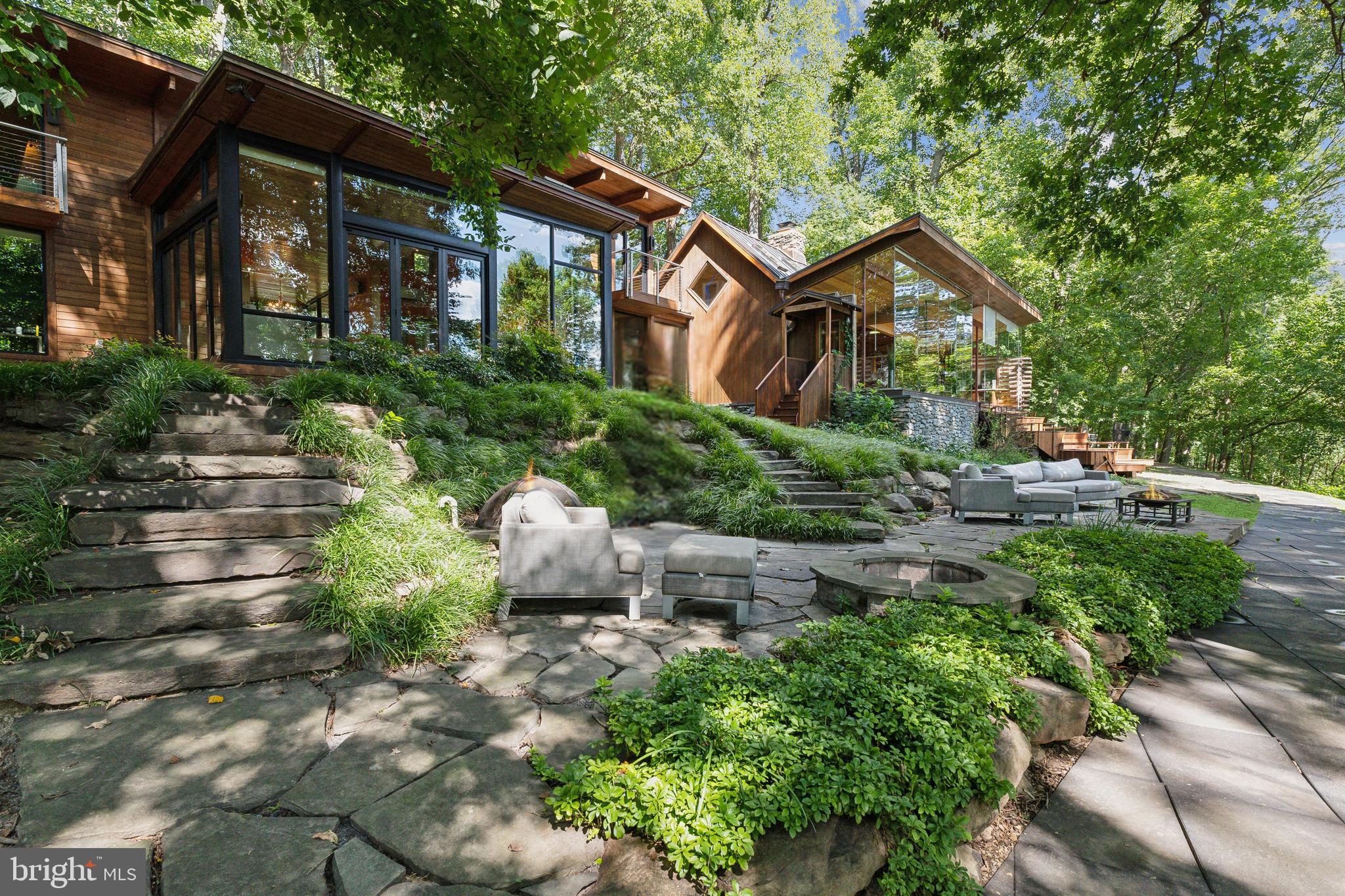 One-of-a-Kind 4-Acre Property With River Views and Space to Create Your Dream Estate

Beautifully updated home set on one of the largest and most private lots in the area. Light-filled interior features vaulted ceilings, expansive windows, and modern finishes throughout. Flexible layout offers multiple living spaces, ideal for work, entertaining, and everyday comfort.

Property includes septic approval for up to 8 bedrooms, providing rare opportunity for future expansion. Outdoor features include sweeping lawns, mature trees, multiple patios and gathering spaces, a lighted tennis court, and a separate guest cabin perfect for visitors, office, or studio use.

Quiet retreat setting just minutes to the C&O Canal, shopping, major commuter routes, and top-rated schools. A unique combination of acreage, privacy, and long-term upside in one of Potomac’s most desirable enclaves.