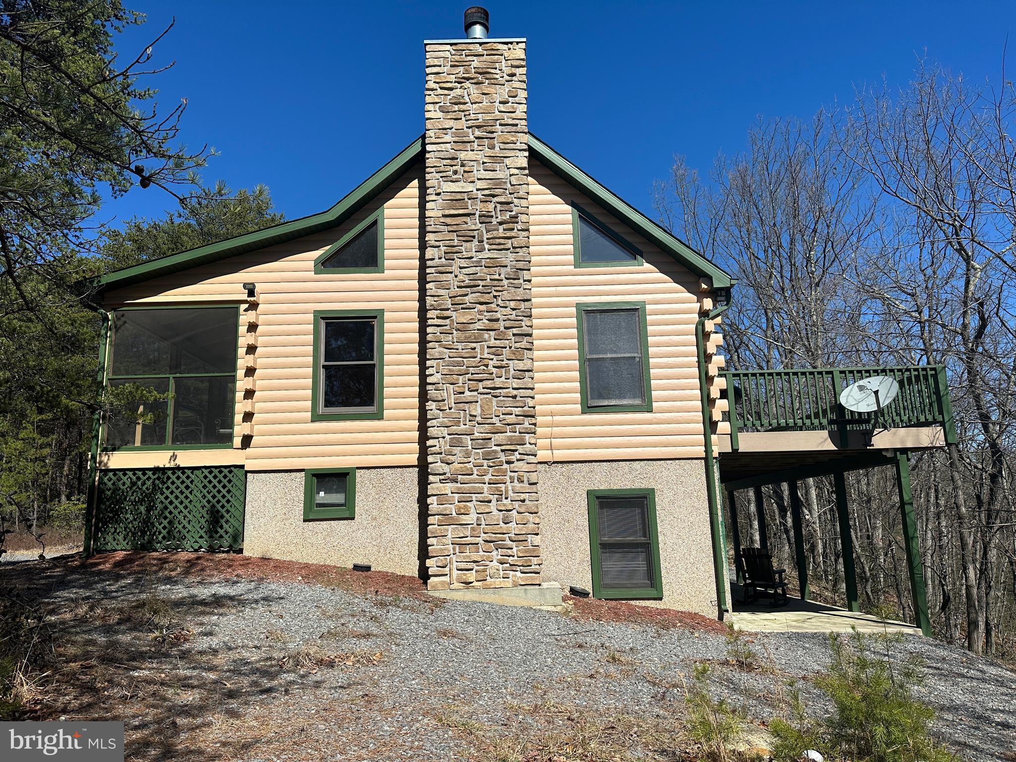 DEAL OF THE DECADE.....ADORABLE LOG CHALET HIDDEN IN THE MIDDLE OF 25 USABLE ACRES WITH PRIVACY TO SPARE. GENTLY ROLLING LAND COVERED IN HARDWOODS, PINES, MT LAUREL, SANDSTONE BOULDERS & ATV TRAILS GALORE WITH 2 SPRING FED WET WEATHER STREAMS. CABIN FEATURES PINE....LOTS OF IT, NO DRYWALL, WOOD BURNING FIREPLACE, HUGE COMPOSITE DECK, SCREENED PORCH AND WHAT YOU SEE IS WHAT YOU GET.....GUN SAFE, SLATE POOL TABLE, BRUSH MOWER & WHAT FURNISHINGS ARE THERE CONVEY. WHY SO CHEAP? THERE'S A DOUBLE SIZED HIGH TENSION POWER LINE ON THE SOUTHERN PROPERTY BOUNDARY APPROX 150 YARDS FROM THE CABIN, YOU CAN SEE THE LINES WHEN THE LEAVES ARE OFF AND YOU CAN SEE THE TOP OF ONE OF THE TOWERS 24/7 365....THOSE ARE THE CONS....THE PROS ARE THAT THE POWERLINE PROVIDES EXCELLENT ATV RIDING, HUNTING, 300+ YARD SHOOTING RANGE AND 12,000 KWH OF FREE ELECTRICITY PER YEAR! FOR A SECOND HOME, YOU'LL PROBABLY NEVER HAVE AN ELECTRIC BILL AND IF YOU LIVE THERE FULL TIME, IT'LL PROBABLY NEVER BE OVER $100 PER MONTH. LOCATED IN THE PRESTIGIOUS 3000 ACRE GATED COMMUNITY OF RIVER RIDGE, ONLY 110 MILES FROM THE WHITE HOUSE, 10 MINUTES FROM THE HAPPENING VILLIAGE OF WARDENSVILLE, TROUT STREAMS, GW NATIONAL FOREST & THE CACAPON & LOST RIVERS AND 30 MINUTES FROM WINCHESTER, VA. GOOD DEALS ARE HARD TO COME BY THESE DAYS, GREAT DEALS NEXT TO IMPOSSIBLE AND DEALS LIKE THIS ARE UNHEARD OF....YOU COULDN'T EVEN REPLICATE THE CABIN FOR 325K. IF THE POWERLINE DEAL FREAKS YOU OUT, THEN SET THIS ONE OUT.....IF IT DOESN'T BOTHER YOU, THEN MAKE THE CALL AND SNAG THIS WHOPPER OF A DEAL BEFORE SOMEONE ELSE BEATS YOU TO THE PUNCH!
