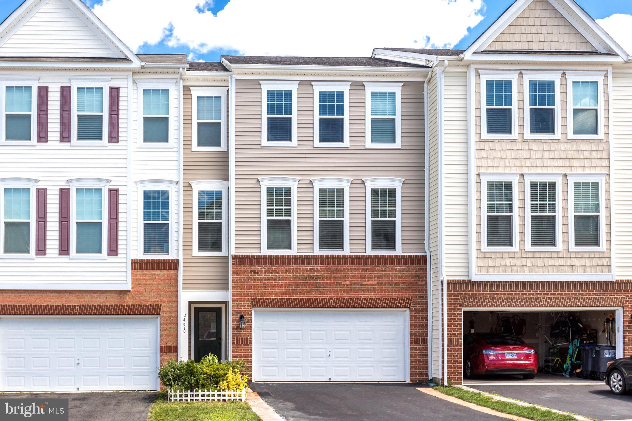IMMEDIATELY AVAILABLE!    Spacious and bright three-level townhome with a two-car garage is located in the highly sought-after Stone Ridge community. Just painted top to bottom.  Enjoy a gourmet kitchen featuring stainless steel appliances, gas cooking, a large island, and a cozy gas fireplace. The open-concept floor plan, high ceilings, and oversized windows fill the home with natural light. The primary suite includes a tray ceiling, walk-in closet, and en-suite bath. All bedrooms feature ceiling fans for year-round comfort. *No rear deck.  With three full bathrooms plus a main-level half bath and an upstairs laundry room, this home offers convenience and style throughout. Stone Ridge is known for its exceptional amenities—community pool, tennis courts, fitness center, and walkable access to shops and public transportation.