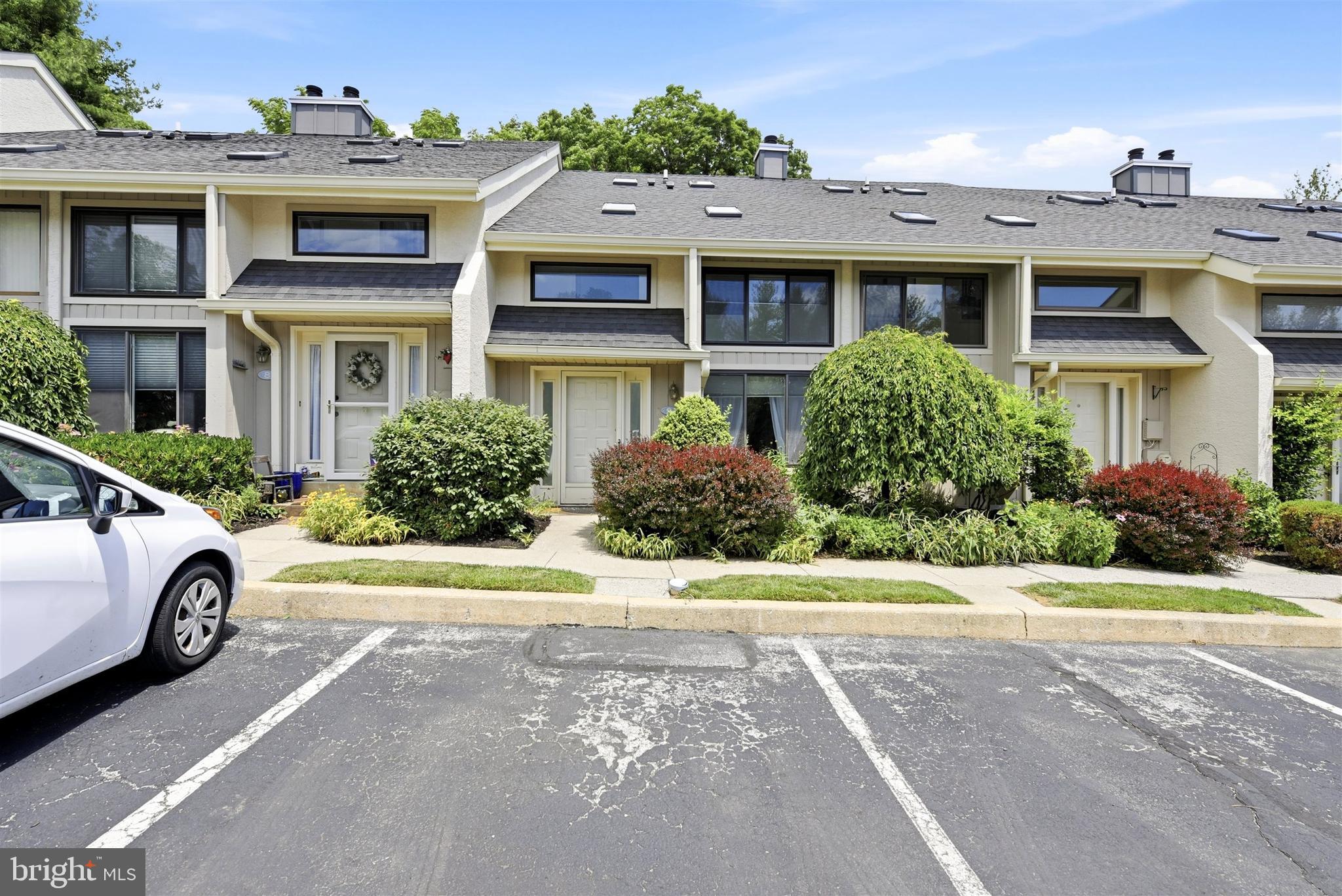 Welcome to this updated townhome in the heart of Malvern Borough, offering the perfect blend of charm, comfort, and convenience in a highly desirable walk-to-train location. Step inside through a bright two-story tiled sunroom filled with natural light from an impressive wall of windows. The sunroom flows seamlessly into the spacious great room featuring hardwood floors and an open-concept layout ideal for both everyday living and entertaining. The stylish white kitchen is thoughtfully updated with granite countertops, stainless steel appliances, abundant cabinetry, and a convenient breakfast bar for casual dining. Sliding glass doors open to a private patio and fenced yard, creating the perfect outdoor retreat with lovely views and space to relax or entertain. Upstairs, the second level offers two generously sized bedrooms, each with large closets and private en-suite baths featuring new vanities. A conveniently located second-floor laundry area adds everyday ease. The third floor provides a versatile third bedroom with excellent natural light, additional closet space, and access to floored attic storage. Peace of mind for the new owner with new HVAC system, washer/dryer, and carpet, as well as newer roof, skylights, and refrigerator! Enjoy an unbeatable location just steps from the Malvern SEPTA Regional Rail line and with quick access to Routes 202 and 76. Walk to local restaurants and shops, and enjoy nearby shopping and dining at Uptown Worthington, including Wegmans and Target.