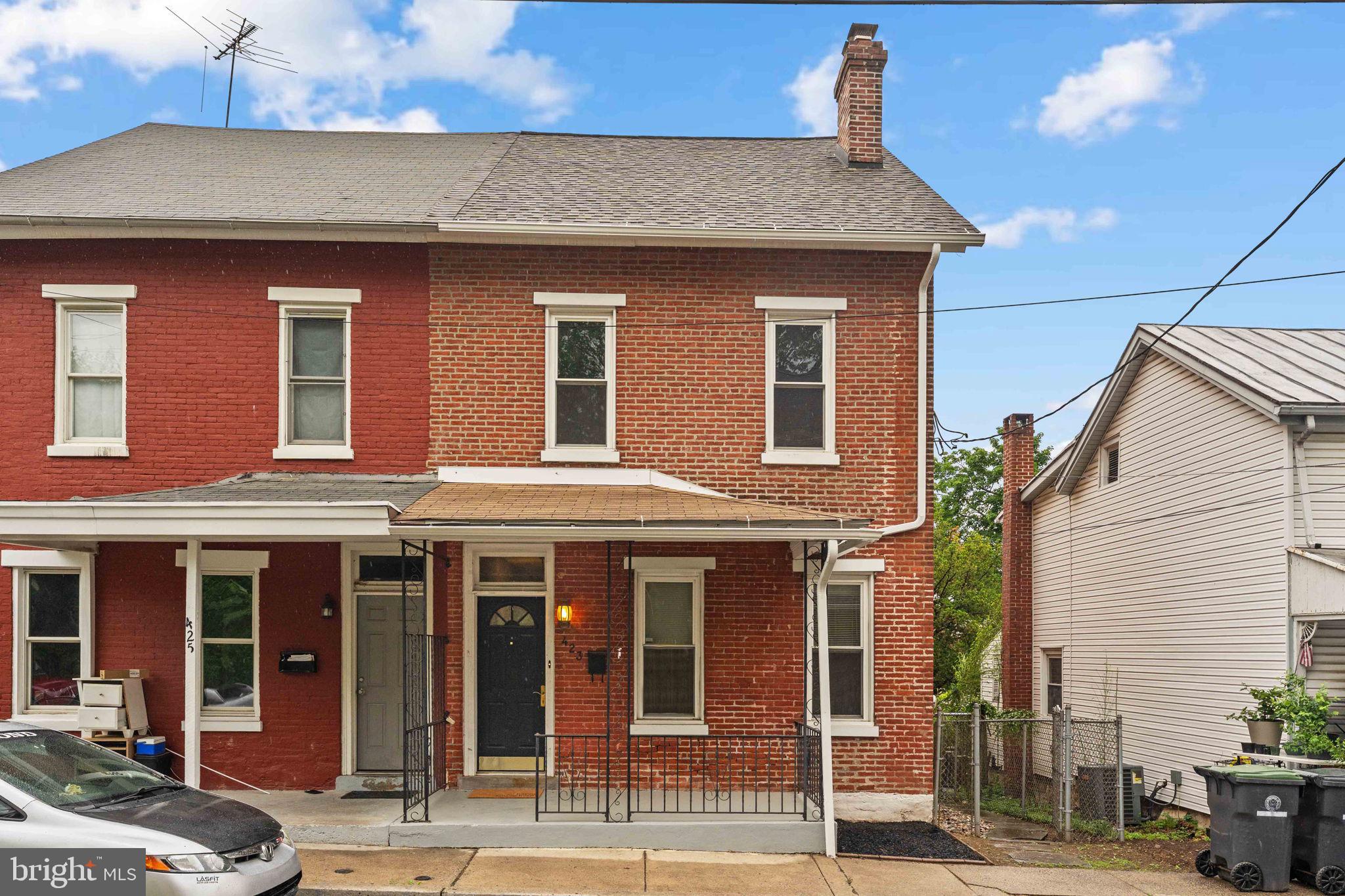 Spacious 5 bedroom 2 bath turn-of-the century brick twin located on a quiet low traffic one-way street in the heart of the highly desirable Phoenixville Borough. Just a short 3 minute walk to the quieter end of bustling Bridge Street, this home offers the perfect balance of peaceful neighborhood living and easy access to Phoenixville’s renowned dining, shopping, breweries, and year round entertainment. Rich in character and thoughtfully updated with today’s modern conveniences, this spacious home welcomes you with an open and inviting main floor layout filled with natural light. Soaring ceilings, oversized baseboards, exposed brick accent walls, modern stainless heat ducts, and beautifully preserved original hardwood floors create the perfect blend of historic charm and contemporary style. The stunning wood staircase and detailed banister with intricate period carvings serve as a true centerpiece of the home. The oversized kitchen has been tastefully refreshed and offers an abundance of space for large gatherings, making it ideal for everyday living and entertaining alike. Recent updates include brand new quartz countertops, all new stainless steel appliances, new luxury vinyl flooring, and fresh paint throughout. The convenient main floor laundry adds functionality rarely found in homes of this era. Upstairs, you will find three generously sized bedrooms and a full bath, offering flexible space for family, guests, home offices, or hobby rooms. The third floor of the home offers two additional bedrooms. Other features include central air conditioning, efficient propane gas heat, and updated finishes throughout while still maintaining the timeless character buyers love in a classic Phoenixville home. Outside, enjoy relaxing mornings on the charming covered front porch or entertain friends and family in the fully fenced flat backyard. The walk out basement provides excellent storage and added convenience. If you have been searching for a home that combines historic charm, modern updates, generous living space, and an unbeatable walkable location in Phoenixville Borough, this is one you will not want to miss!