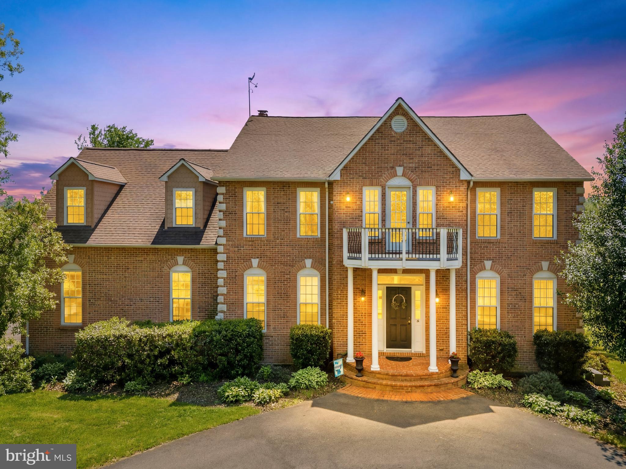 Perched on more than 10 picturesque acres in the rolling hills of Waterford, this exceptional estate captures some of Loudoun County's most breathtaking year-round views. From vibrant sunrises enjoyed through the kitchen window to sweeping green vistas surrounding the property, every aspect of this home celebrates its stunning natural setting.

Designed for both elegant entertaining and comfortable everyday living, the thoughtfully maintained interior features a beautifully appointed kitchen with custom cabinetry, countertops, backsplash, newer appliances, and bar seating. Open to the family room and framed by a dramatic wall of windows, the space is filled with natural light and uninterrupted views of the countryside. The main level also offers a private office, formal living room, and dining room, creating a versatile and functional layout.

Upstairs, the spacious primary suite serves as a private retreat with a well-appointed bath. Three additional bedrooms are served by a hall bath, while the fifth bedroom enjoys its own private en-suite bath, providing ideal accommodations for guests or multigenerational living.

The finished lower level expands the living space with a recreation room, exercise room, full bath, and abundant unfinished storage. Outside, the in-ground pool overlooks rolling pastures and endless vistas, creating a spectacular setting for relaxation and entertaining. Recent improvements include pool tile and coping, a paved driveway, an insulated garage, and a new hot water heater, enhancing both comfort and long-term value.

Located just beyond the historic Village of Waterford, residents enjoy easy access to the W&OD Trail, renowned wineries and breweries, charming local shops, and countless outdoor recreation opportunities. Convenient to Routes 7 and 9, the Dulles Greenway, Dulles International Airport, and Washington, DC, this remarkable property offers the perfect balance of privacy, beauty, and accessibility.