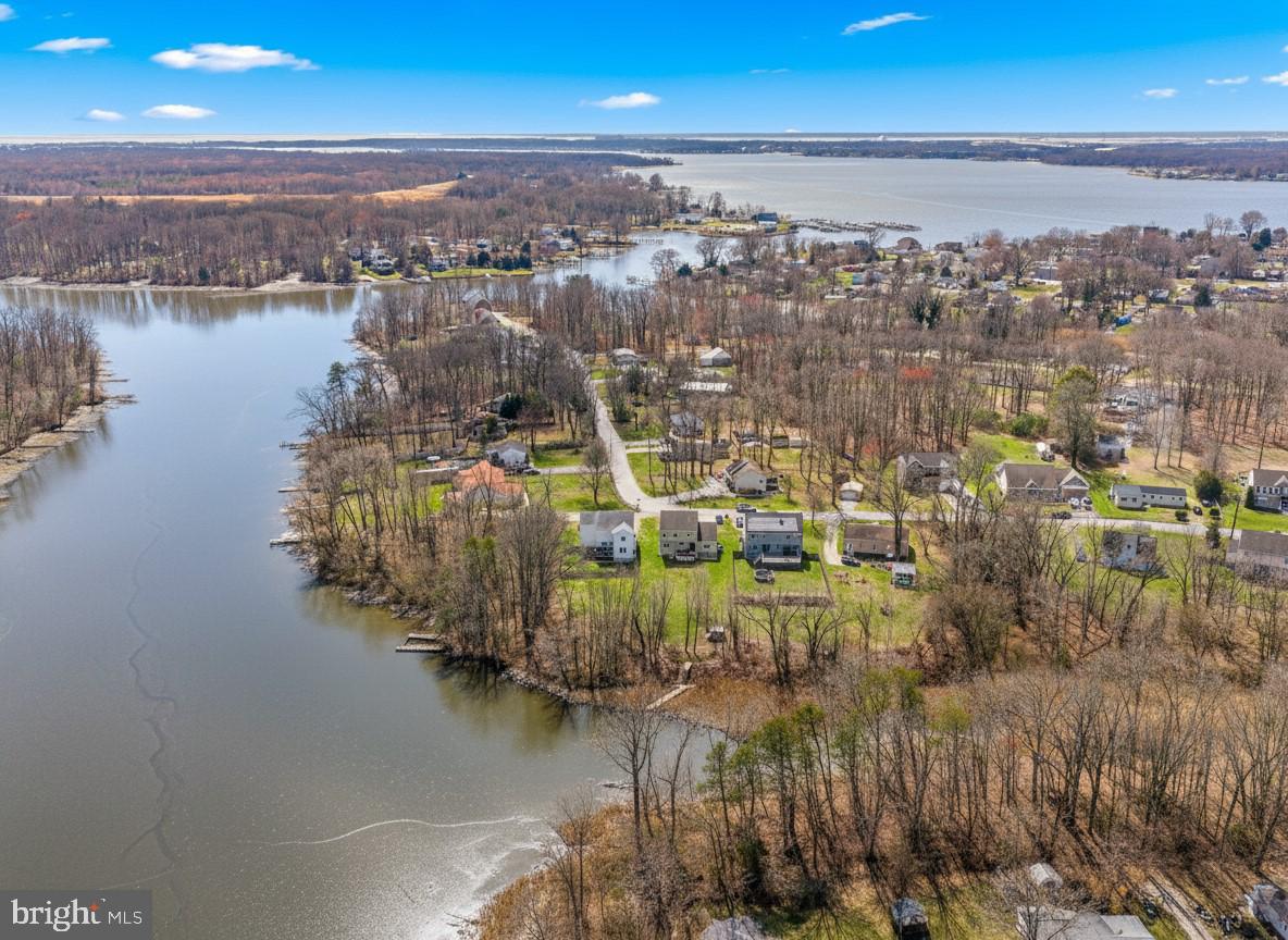 Open House 7/11 11am-1:30pm! A rare, waterfront find in Baltimore County with NO HOA! 
If you’ve been searching for a truly move-in ready home with over 3,000 sq ft of updated space AND direct water access, this is it. Situated on a prime canal-front lot with 60 feet of water frontage, this property is a water lover's paradise.

*OUTDOOR LIVING + THE WATERFRONT & DOCK DETAILS:

**Active River Channel: Boats travel up and down this navigable channel, perfect for fishing, kayaking, and paddleboarding.

**Incredible Dock Potential: The current dock is built for foot traffic, but it features the perfect footprint to be extended out to the water and structurally built with proper poles to house your motorized boat! (Buyers just need to check tides and V-channel depth for their specific vessel fit).

**Enjoy outdoor living on a high-end Trex deck installed the end of 2024 perfect for entertaining and taking in the water views.

*INSIDE THE HOME:
**Canal-front living meets modern renovation. This home features natural light and new 20mm engineered wood flooring throughout the home (no carpets for easy clean-up).

**The kitchen was fully upgraded with new cabinets,  stainless steel appliances, wine cooler, and a double-sided refrigerator, high-end quartz countertops, a ceramic tile backsplash, under-cabinet lighting, water filtration, and instant hot water systems.

**Upper Level Retreat: Features 3 spacious bedrooms and 2 full bathrooms, including an en suite primary bathroom with a jetted tub.

**Versatile Lower Level: Fully finished basement with a private separate entrance, full bathroom, and a rough-in for a kitchenette. Functions perfectly as a movie room, play space, an in-law suite, rental potential, or a premium home office.

*EXTRAS:

**Attached Garage: Fully equipped with wall-to-wall storage cabinetry.

**Shed + Bonus: Storage shed in the yard comes with the ride-on lawn mower included to convey with the property!

**Security & Smart home features: Equipped with a full home alarm system, smart keypads, and bedroom lights that can be controlled from your phone.

*PEACE OF MIND & MECHANICS (UPDATED 2025):

**HVAC System: Fully serviced at the end of 2025 with a brand-new motor and full air handler maintenance completed for maximum efficiency.

**Water Heater: Completely serviced at the end of 2025.

Enjoy the ultimate peace of waterfront living with unmatched commuter convenience to I-95, I-695, downtown Baltimore, and White Marsh. Truly turn-key and ready for summer. Schedule your tour today!