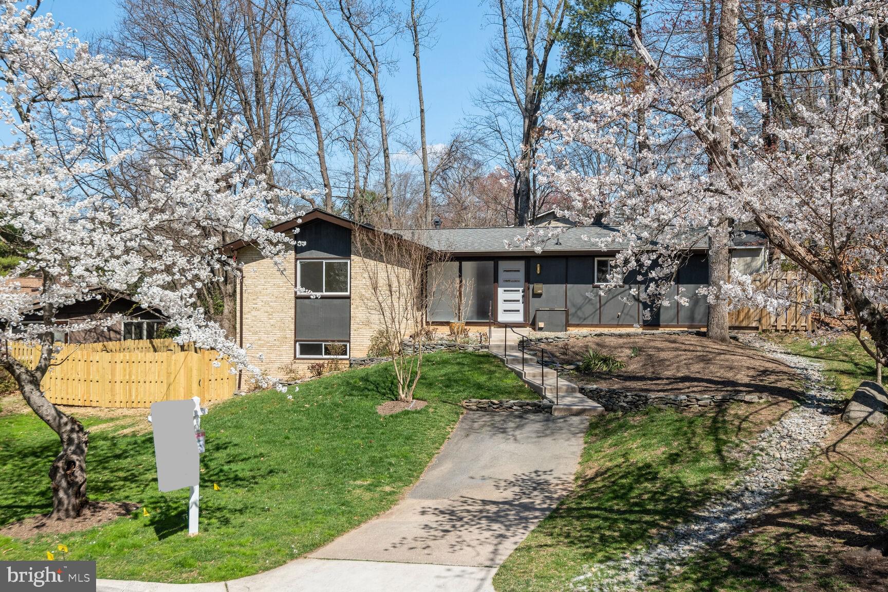 Embrace the epitome of modern living in this meticulously renovated, light filled property in Manor Woods! This stunning property has undergone a complete renovation, preserving its original allure while integrating modern amenities seamlessly. Located in the sought-after community of Rockville, this residence offers a perfect blend of comfort, style, and functionality. Enjoy the lifestyle by joining Manor Woods Swim Club, just down the street, for a sun filled summer.

This home has undergone an extensive renovation, seamlessly blending original charm with modern amenities for the ultimate in comfort and style. With an open floor plan, experience a seamless flow between living spaces, perfect for entertaining or everyday living. Step onto the back patio from the kitchen and dining space to enjoy a tree lined yard for privacy. The upgraded fireplace adds warmth and elegance to the living space. Newly installed waterproof luxury vinyl plank flooring throughout the home combines style with durability. New appliances throughout, including a Frigidaire refrigerator and LG washer/dryer.

State-of-the-Art Electrical Upgrade: Enjoy peace of mind with a 220 Heavy Up electrical upgrade from the street, along with a new meter and electrical panel featuring Arch Protect Breakers. New electrical wiring throughout the house ensures safety and reliability. Benefit from new plumbing throughout the entire house, including upgraded copper water lines and PVC drains, ensuring efficient water flow and longevity. New HVAC with smart technology was installed as well. Stay comfortable year-round with a new HVAC system, including indoor and outdoor units, complemented by a Nest thermostat for convenient climate control. A new Ring doorbell adds an extra layer of security and convenience. The stylish upgrades also include new windows, entrance doors with digital locks, and refreshed external light fixtures. The roof was upgraded to 4-Star Landmark Architectural Roof for long-lasting durability. The landscaping and fresh exterior paint enhance the curb appeal, creating an inviting atmosphere. 

Don't miss the opportunity to call this exceptional property home!