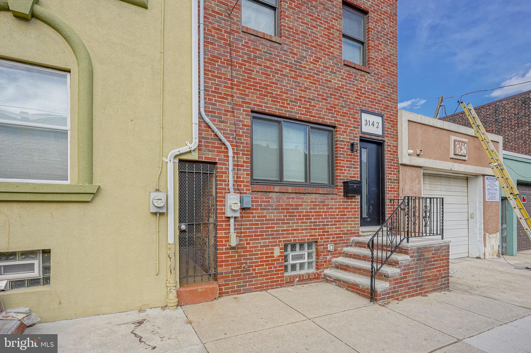 Welcome to 3142 Belgrade St! A rare Street-to-Street 80% New Construction masterpiece. Located at the heart and center of the Port Richmond neighborhood. Situated between Allegheny Ave and Clementine St. What you are about to see is magnificent and stunning.  This home is 80% New Construction with just only 20% of the old house still remaining. Step inside to a very large living room and dining room open combination. Tall ceilings with tons of lighting. Custom woodwork like the shelving in the living room you will find in different areas of the house. In to the kitchen which is very large. The kitchen runs over 17 feet in length and has gorgeous floors, beautiful granite counters, a custom storage space with wood counters that run the entire length of the kitchen. You can have all of the pots, pans, cookware, gadgets, coffee makers, and whatever you can think of in this kitchen! Top it off with a Samsung Stove/oven and Refrigerator. Heading to the 2nd floor now. You will notice right away that the hallway and bedrooms feel extra spacious because of the tall ceilings throughout. To the back of the 2nd floor is the main bedroom. This perfect sized bedroom features two large closets. The en suite bathroom is a complete jaw dropping wow factor. The bathroom double shower is massive and exquisite.  You start to think about it! Beautifully done with a double sink, very large mirror, and incredible craftsmanship. This bathroom and the hall bathroom both have heated floors as well. Then walking down the hall is the main hall bathroom which again is just bright and beautiful. There is a full size laundry room with washer and dryer included and utility sink for convenience on this 2nd floor. Then the 2nd bedroom is located at the front of the house. Also a great size bedroom with plenty of custom closet space. Then we go upstairs to the 3rd floor. You are immediately greeted by an open room that was left open on purpose. This space is large and could be an amazing office space. It could be a party room with bar. From this room you can walk onto the balcony/roof deck which overlooks the large backyard. There is also a powder room off to the side right before you step out as well. Thought was put into this as it could be a wonderful room for gatherings/parties. You decide! Then this 3rd floor also contains the 3rd bedroom. Another very spacious room with custom closets that faces the front of the house. When you exit the back sliding doors in the kitchen, you walk out onto a nice concrete patio area and you will see the very large yard that extends all the way to the street behind. This Property is very unique that it is a street to street Property that runs to Miller St. At the sidewalk on Miller St, the curb was already cut and used as a driveway for many years. There are endless possibilities here to either create an awesome driveway for yourself or a backyard paradise. Or why not both! The grass area yard space is an approximate total of 68 feet! This home was meticulously worked on for 2 years. Built with the finest materials, skill and care. Dual Zoned heating and air conditioning. High Efficiency. Perfect location with access to 95 north or south and the Betsy Ross Bridge to NJ within 10 minutes. Just a few minutes to fishtown and very quick to downtown Center City.  Be sure not to miss it!   Buyer responsible to verify square footage and real estate taxes. All measurements are approximate and need to be independently verified.