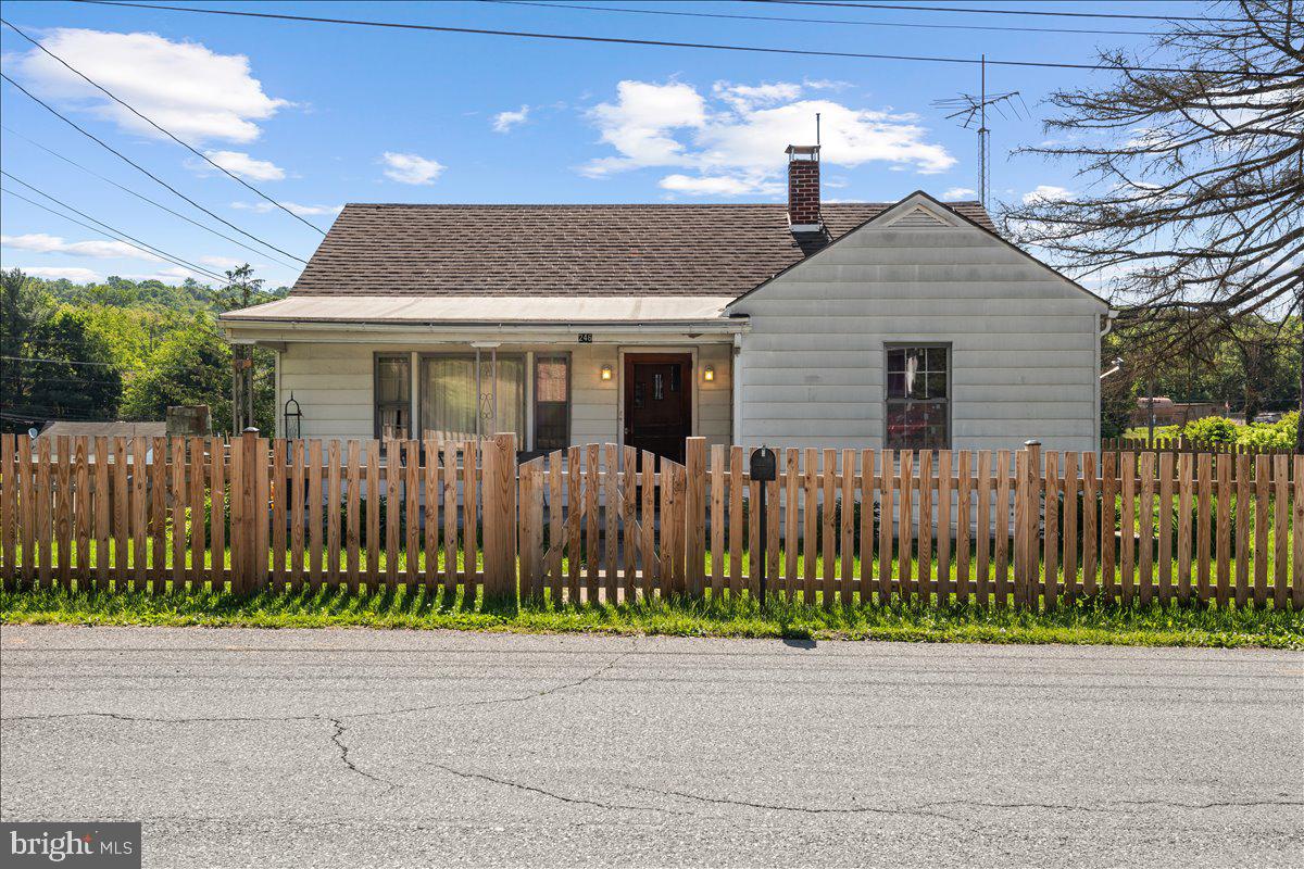 Charming 1950s Rancher in Prime Hancock Location!
This solidly built 1950 rancher offers the perfect blend of classic comfort and modern updates in the heart of Hancock. Featuring 2 spacious bedrooms and 1 full bathroom, this cozy single-level home sits on a full basement with garage and rests on a desirable corner lot with a fully fenced front and side yard.
Step inside to beautiful hardwood floors throughout, creating a warm and inviting atmosphere. The updated bathroom boasts a newer walk-in tub/shower combo, perfect for easy, comfortable living. Generous closets provide excellent storage, and the home is equipped with central air conditioning, natural gas heat, and a natural gas water heater for year-round comfort and efficiency.
Outside, enjoy the welcoming covered front porch, ideal for morning coffee or evening relaxation. The rear patio features a fireplace — perfect for chilly evenings, family gatherings, or weekend grilling. The fenced yard is mostly flat and highly usable, offering plenty of space for pets, play, or gardening.
Located on a quiet corner lot, this home is incredibly convenient — just minutes from I-70 and I-68 for easy commuting, as well as the Potomac River boat ramp, Western Maryland Rail Trail, C&O Canal, and all the shops, dining, and amenities Hancock has to offer. Whether you're looking for a peaceful retreat or an active lifestyle with trails and waterways at your doorstep, this home delivers.
Solid bones, thoughtful updates, and an unbeatable location make this rancher a true gem. Don’t miss your chance to call it home!