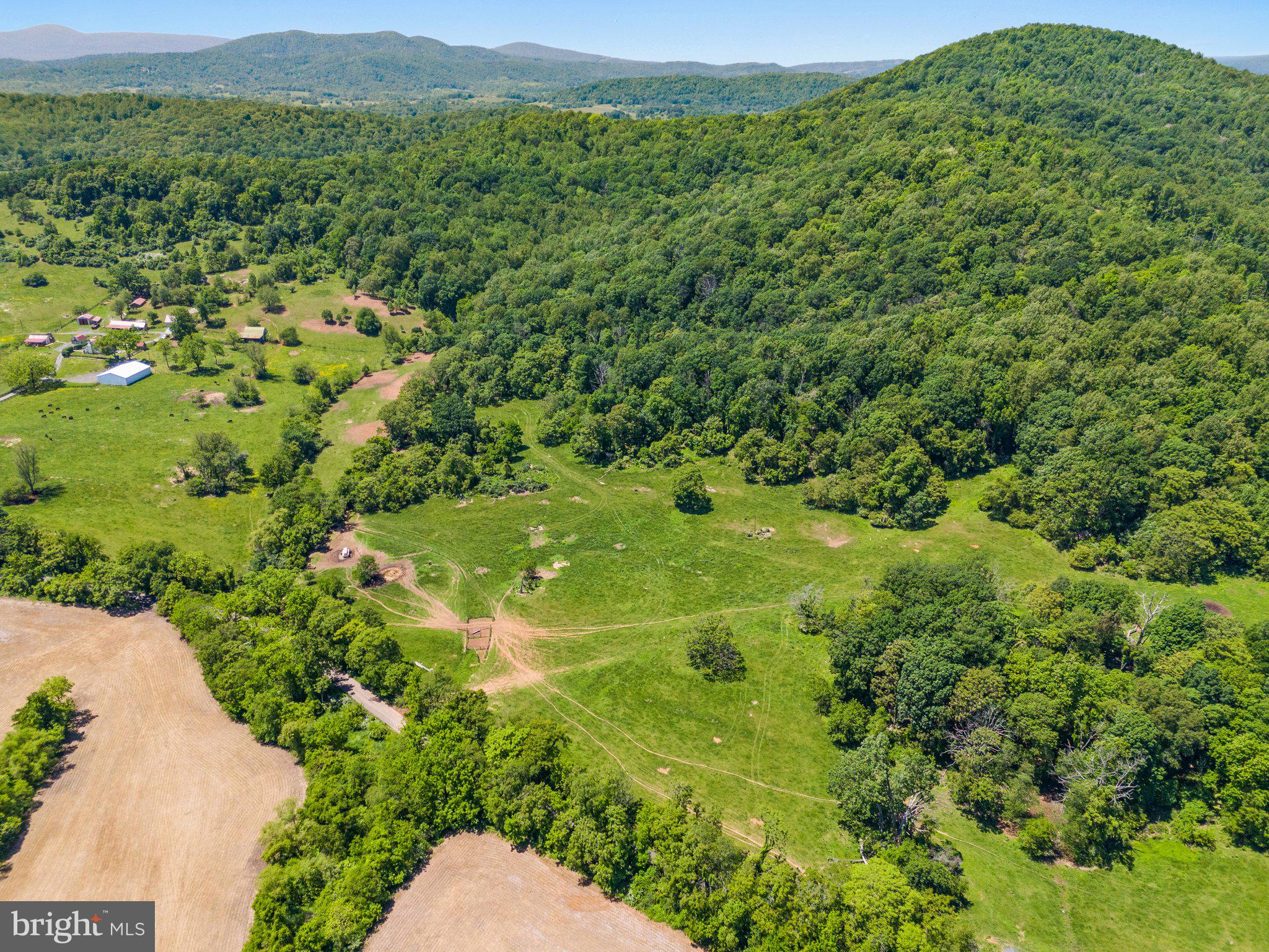 Discover the potential of this expansive 86-acre property located on Ramey Road in Marshall, Virginia. This versatile land offers a mix of pastures, mature hardwoods, and scenic views, making it ideal for various rural uses. Suitable for livestock, horses, or custom home development, the property provides a perfect canvas whether you are looking to establish a working farm, create an equestrian haven, or build your dream home in a tranquil setting. Enjoy beautiful pastures and natural tree lines while benefiting from the proximity to Main Street, Marshall, which ensures convenience without sacrificing the serenity of country living. There is not a conservation easement held on the property. The Fauquier County subdivision potential letter says 5 lots plus residue which is dependent on slopes, drainfields and well placements. The property participates in the Cobbler Mountain Agricultural and Forestal District, and Fauquier County Agriculture Land Use program. Showings are by appointment only.
