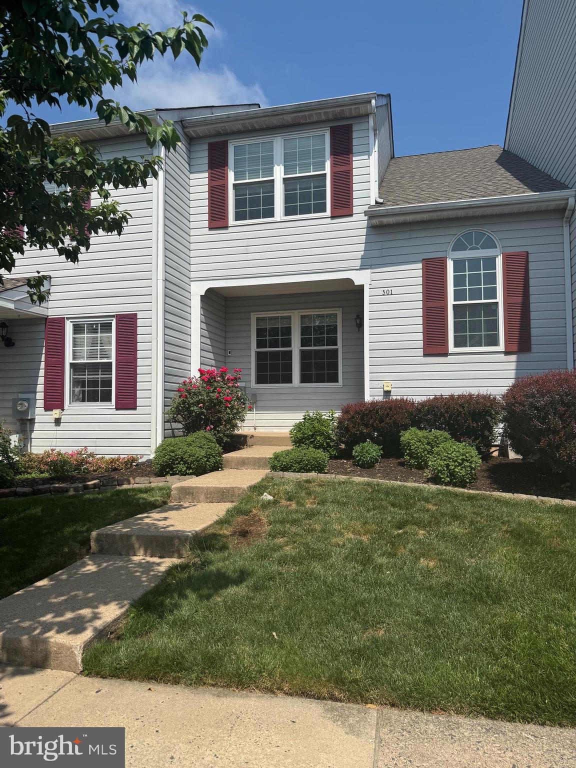 Immaculate and move-in ready, this beautifully maintained 2-bedroom, 2.5-bath townhome in Wethersfield offers neutral décor, tasteful finishes, and comfortable living spaces throughout. A welcoming two-story foyer with an arched window fills the entry with natural light. The updated galley kitchen features stainless steel appliances, quartz countertops, soft-close cabinets and drawers, and a built-in microwave. The bright dining room is accented by a double window, ceiling fan with light, and an open view to the foyer. The spacious living room features new carpeting and sliding doors leading to a large 18' x 13' Trex deck with a convenient storage closet/shed. Upstairs, the primary bedroom offers two double closets and a spacious private bath with a linen closet and large corner stall shower featuring dual shower heads. A second bedroom with a double closet and double window, a full hall bath with tub/shower and dual shower heads, a hall linen closet, and a laundry area complete the upper level. The unfinished basement provides abundant storage and workspace with built-in shelving and a workbench included. Parking for two vehicles is available directly in front of the home. The HOA fee includes lawn care, snow removal, trash service, and common area maintenance. Ideally located near a neighborhood park with sports fields, courts, a playground, and picnic pavilion, and just minutes from major roadways, shopping, dining, and everyday conveniences.