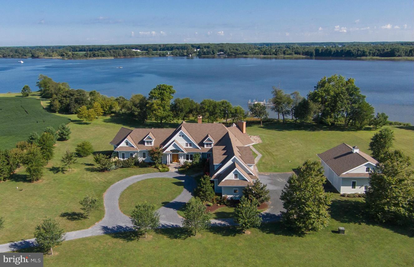 Enjoy coastal living in this classic Nantucket-style estate * Sited on 5 manicured acres on the Corsica * Waterside swimming pool * Private pier with 3 lifts * Granite Chef's Kitchen * Owners Suite with His & Hers tumbled marble baths * All en suite bedrooms inc. huge game rm/apartment * 3-car garage plus detached 2-story garage for boats and/or car enthusiasts * /Court approval obtained!