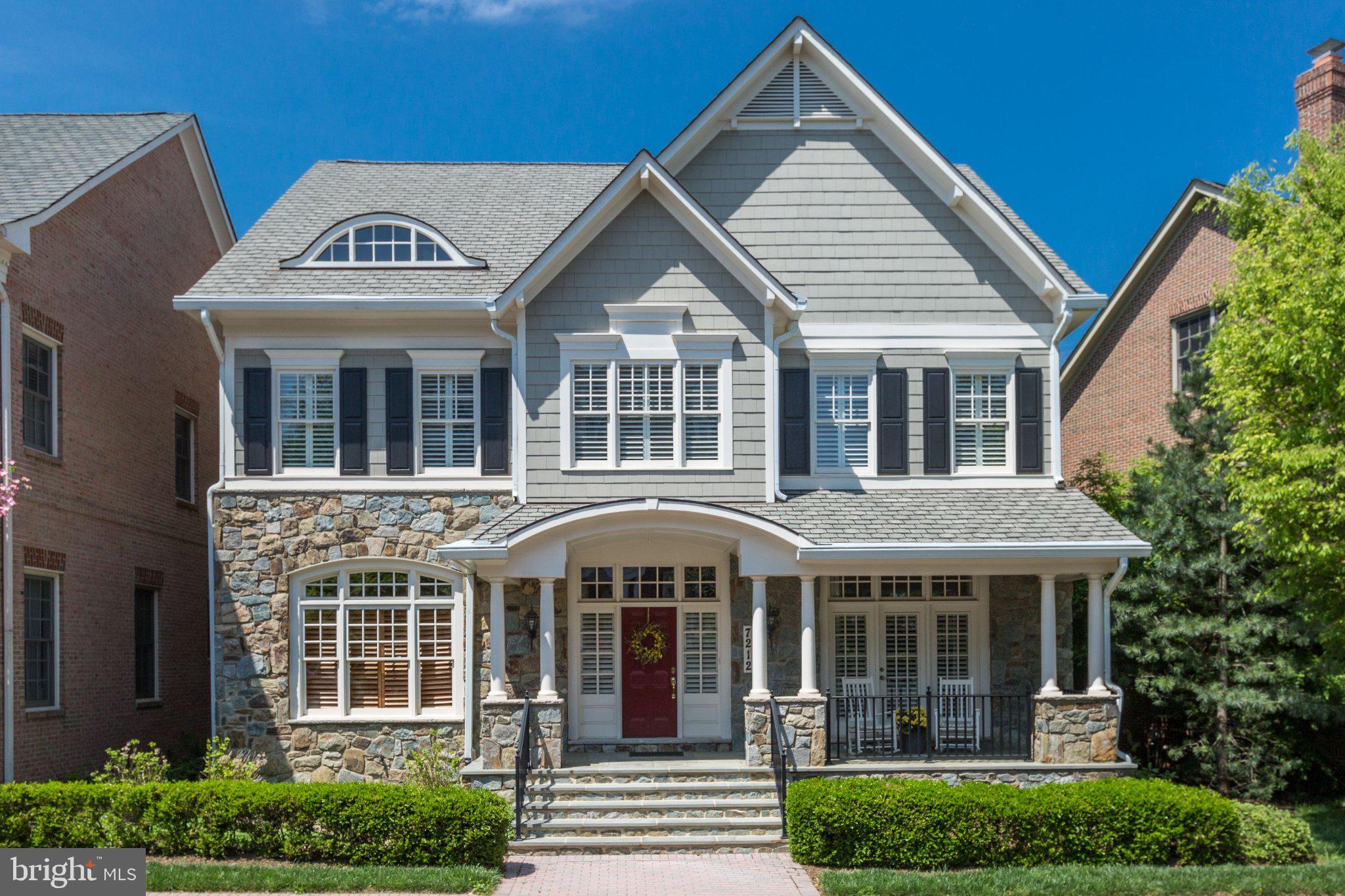 Nestled within the gated community of Evans Farm, this gracious home is surrounded by protected green space, pocket parks, brick sidewalks, and mature trees. The Nantucket-inspired exterior blends stone and shingle siding, welcoming you with a charming covered front porch and a spacious flagstone patio in the rear—ideal for outdoor living and entertaining.
     Inside, four beautifully finished levels offer 5 bedrooms, 5.5 baths, and the rare convenience of elevator access to three floors. The foyer opens to a light-filled main level with soaring 10-foot ceilings, rich hardwood floors, and deep crown molding throughout. This level features an elegant parlor, a private office with custom built-ins, a powder room, a formal living and dining room, and a stunning kitchen that flows seamlessly into the family room and casual dining area. The kitchen is thoughtfully designed with glass-front cabinetry accented by interior, above- and below-cabinet lighting, a Viking range, and two Thermador wall ovens—three ovens total—making it ideal for hosting gatherings large and small.
     Upstairs, the expansive primary suite offers a peaceful retreat with a sitting area, two walk-in closets, and a spa-like bath featuring a soaking tub, separate shower, water closet, and dual vanities. The finished attic level provides a private fifth bedroom suite with its own sitting area and ensuite bath, perfect for guests or extended stays.
     The lower level features a well-appointed recreation room with a surround-sound home theater, an adjoining game area with a wet bar, a generously sized exercise room, and a full bathroom, providing a versatile and functional space for recreation and entertaining.
     Throughout the home, you’ll find plantation shutters, remote-controlled shades in the living and family rooms, and Lutron lighting controls. Outside, the generous stone patio overlooks a landscaped pond and the historic Mill House—an idyllic setting for morning coffee, evening wine with friends, or grilling dinner on the included gas grill. A rear-loading two-car garage is complemented by convenient guest parking just steps away, while the newly renovated Stone House serves as a vibrant gathering place for community events.
     Evans Farm is truly exceptional, offering both a cohesive, beautifully maintained gated environment and an unbeatable location. Just blocks from the Lewinsville Park Farmers Market and downtown McLean, minutes from Tysons Corner’s world-class shopping, and close to premier cultural venues including Capital One Hall and Wolf Trap, this home also provides easy access to Georgetown, downtown DC via the scenic GW Parkway, and both IAD and DCA airports.