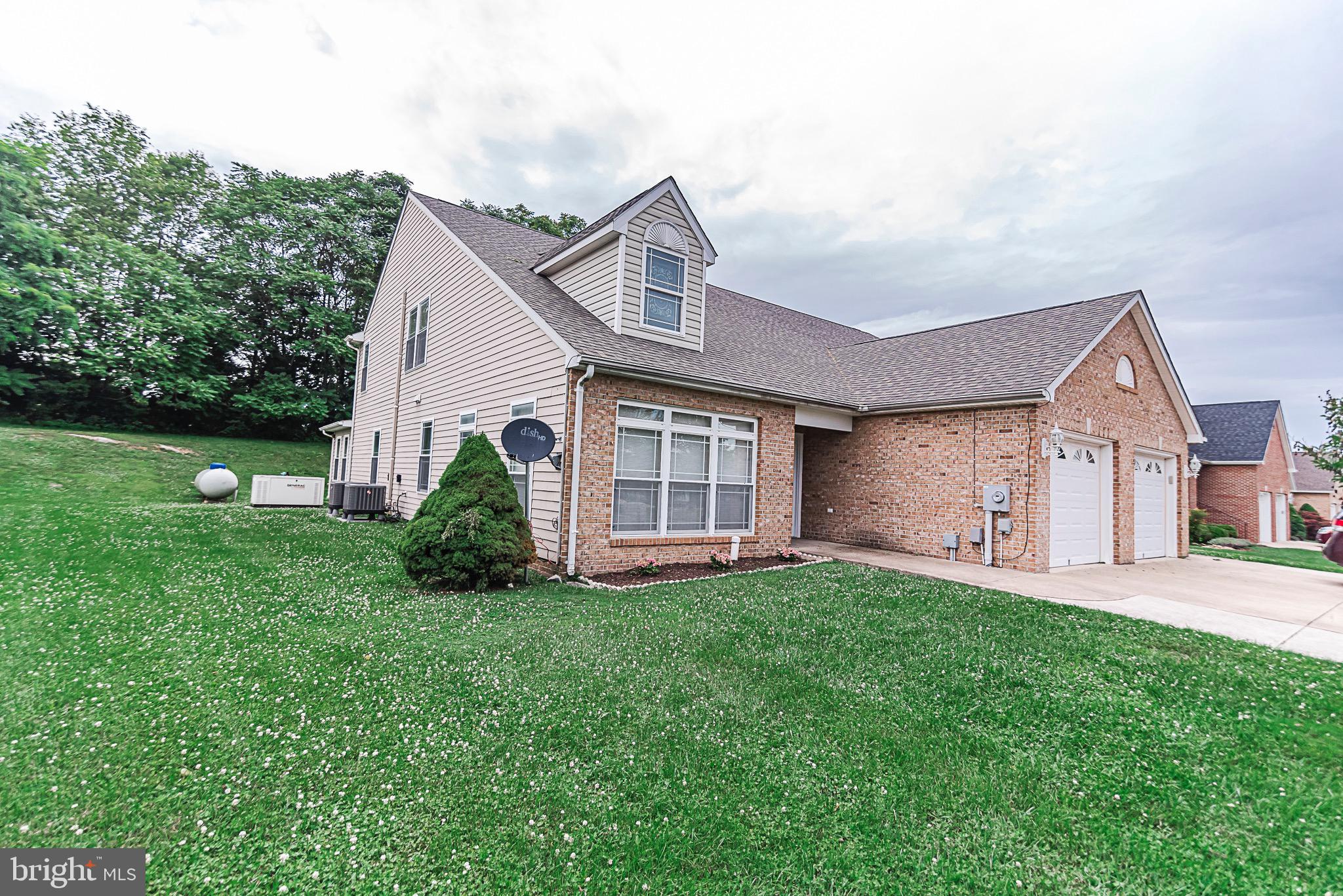 Located in Desirable Locust Hills a must See Beautiful 4 Bedroom 2.5 Bath Villa with a first floor Primary Bedroom/Bath, with brick front, and an enclosed concrete Patio. Living Room, country kitchen with Stainless steel appliances, and separate dining room offer a large living area. New roof in 2018! Harwood flooring, and propane generator included.