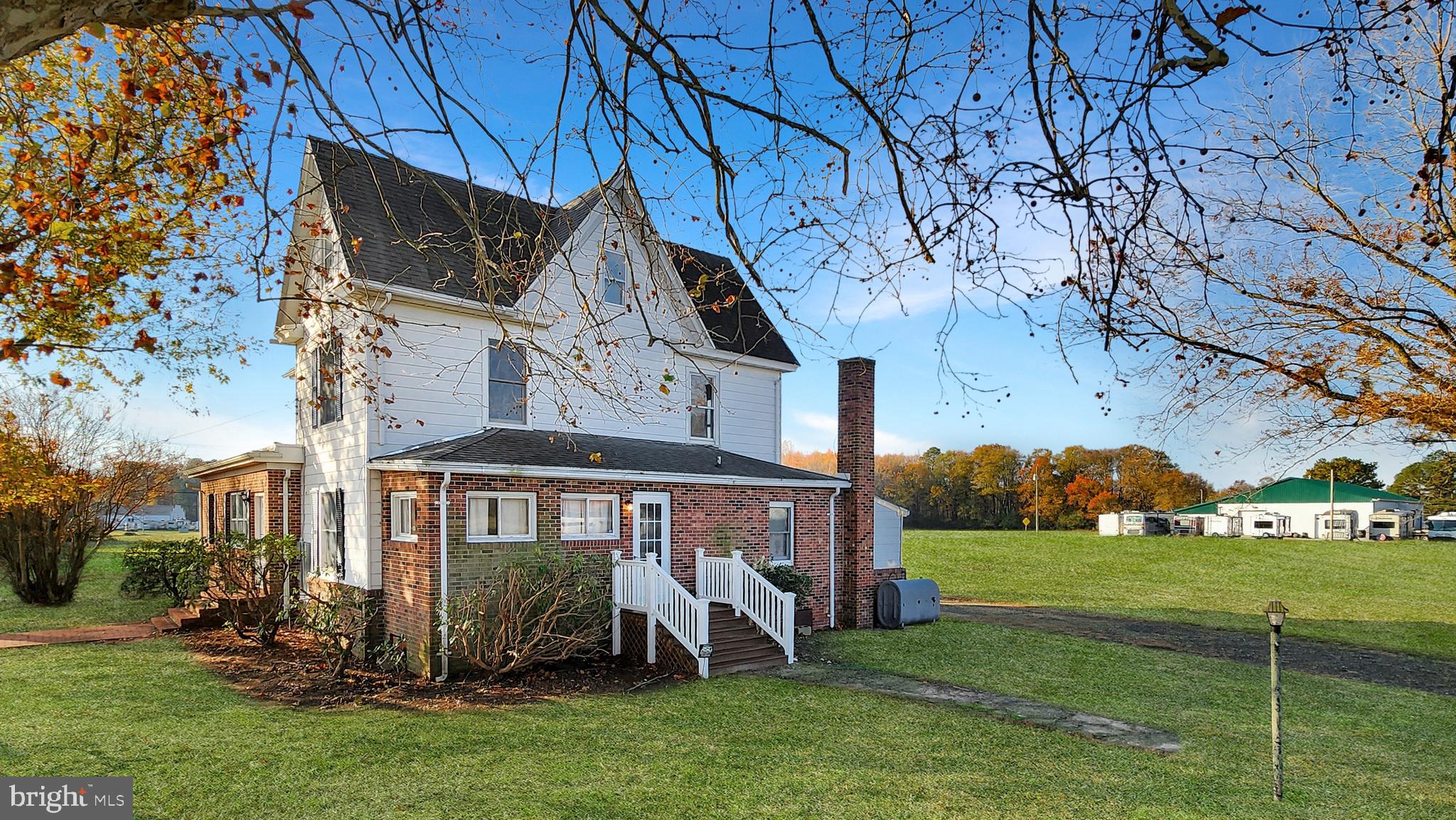 Welcome to your slice of countryside paradise where space isn't just a luxury—it's practically a lifestyle! This charming three-bedroom home offers an impressive 2,549 square feet of comfortable living that flows beautifully from room to room.  Including a full bath and quarter bath on the first floor.

Step inside to discover an oversized living room perfect for hosting game nights or simply spreading out with a good book. The wood burning fireplace creates the ideal focal point for cozy evenings, while the separate office space means you can finally have that dedicated workspace you've been dreaming about. The dining area connects seamlessly to daily life, and the enclosed bonus porch-room adds extra living space. 

Upstairs, three well-appointed bedrooms provide peaceful retreats, complemented by a half bath upstairs. The full walk-up attic offers tremendous potential for storage or future expansion.

Two massive pole barns provide endless possibilities for hobbies, storage, or agricultural pursuits. The detached two-car garage includes a workshop space for the tinkerer or craftsperson in your life. Whether you're storing boats, working on projects, or pursuing rural interests, you'll have space in abundance.

There is also a new, 200 amp electric service. 

Located in an area with no city taxes, this property combines rural charm with practical benefits. The generous grounds and multiple outbuildings make this an exceptional opportunity for buyers seeking both indoor comfort and outdoor potential in one remarkable package.

(Tax Map information and assessments are subject to change as property was recently subdivided to reflect the 2 acres)