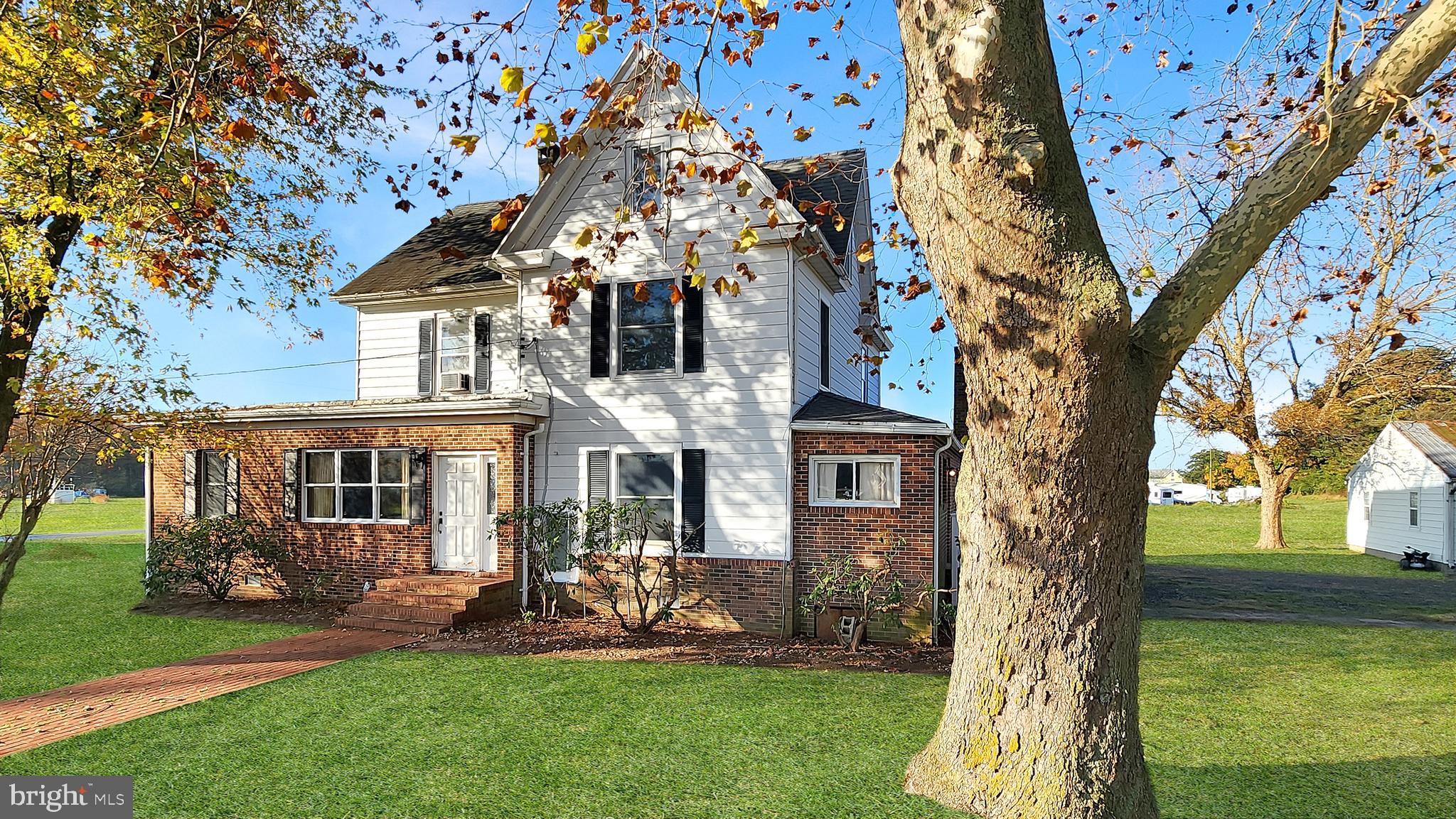 Welcome to your slice of countryside paradise where space isn't just a luxury—it's practically a lifestyle! This charming three-bedroom home offers an impressive 2,549 square feet of comfortable living that flows beautifully from room to room.  Including a full bath and quarter bath on the first floor.

Step inside to discover an oversized living room perfect for hosting game nights or simply spreading out with a good book. The wood burning fireplace creates the ideal focal point for cozy evenings, while the separate office space means you can finally have that dedicated workspace you've been dreaming about. The dining area connects seamlessly to daily life, and the enclosed bonus porch-room adds extra living space. 

Upstairs, three well-appointed bedrooms provide peaceful retreats, complemented by a half bath upstairs. The full walk-up attic offers tremendous potential for storage or future expansion.

Two massive pole barns provide endless possibilities for hobbies, storage, or agricultural pursuits. The detached two-car garage includes a workshop space for the tinkerer or craftsperson in your life. Whether you're storing boats, working on projects, or pursuing rural interests, you'll have space in abundance.

There is also a new, 200 amp electric service. 

Located in an area with no city taxes, this property combines rural charm with practical benefits. The generous grounds and multiple outbuildings make this an exceptional opportunity for buyers seeking both indoor comfort and outdoor potential in one remarkable package.

(Tax Map information and assessments are subject to change as property was recently subdivided to reflect the 2 acres)