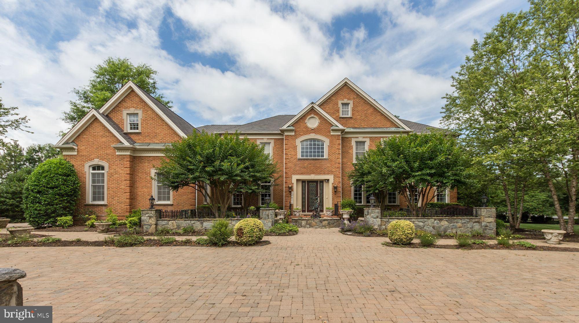 Originally this was the Toll Brothers Model Show House w/every conceivable option added - Sun Room, Music/Conservatory, Two Story Foyer, Two Story Family Room, Main Level Library and more!  Custom details, built-ins throughout.  Exceptional Master Suite with Sitting Rm, Bar, Fireplace and Big Master Bath.  Children's rooms are both Suites w/Bedroom AND separate play/homework room! Fantastic Party-Ready Lower Level w/Big Wet Bar, Rec Room, Wine Cellar, Billiard Room, Home Theater.  Exceptional private entrance Au-Pair/In-Law Suite with separate Living Room/Bar and Bedroom.  Expansive hardscaping outside including a full paver driveway, decorative stone walls and columns, a backyard pergola, recirculating river rock stream bed, gated garage area entrance plus professional landscaping around the entire property.  You can't rebuild this at it's list price.  Come buy today!