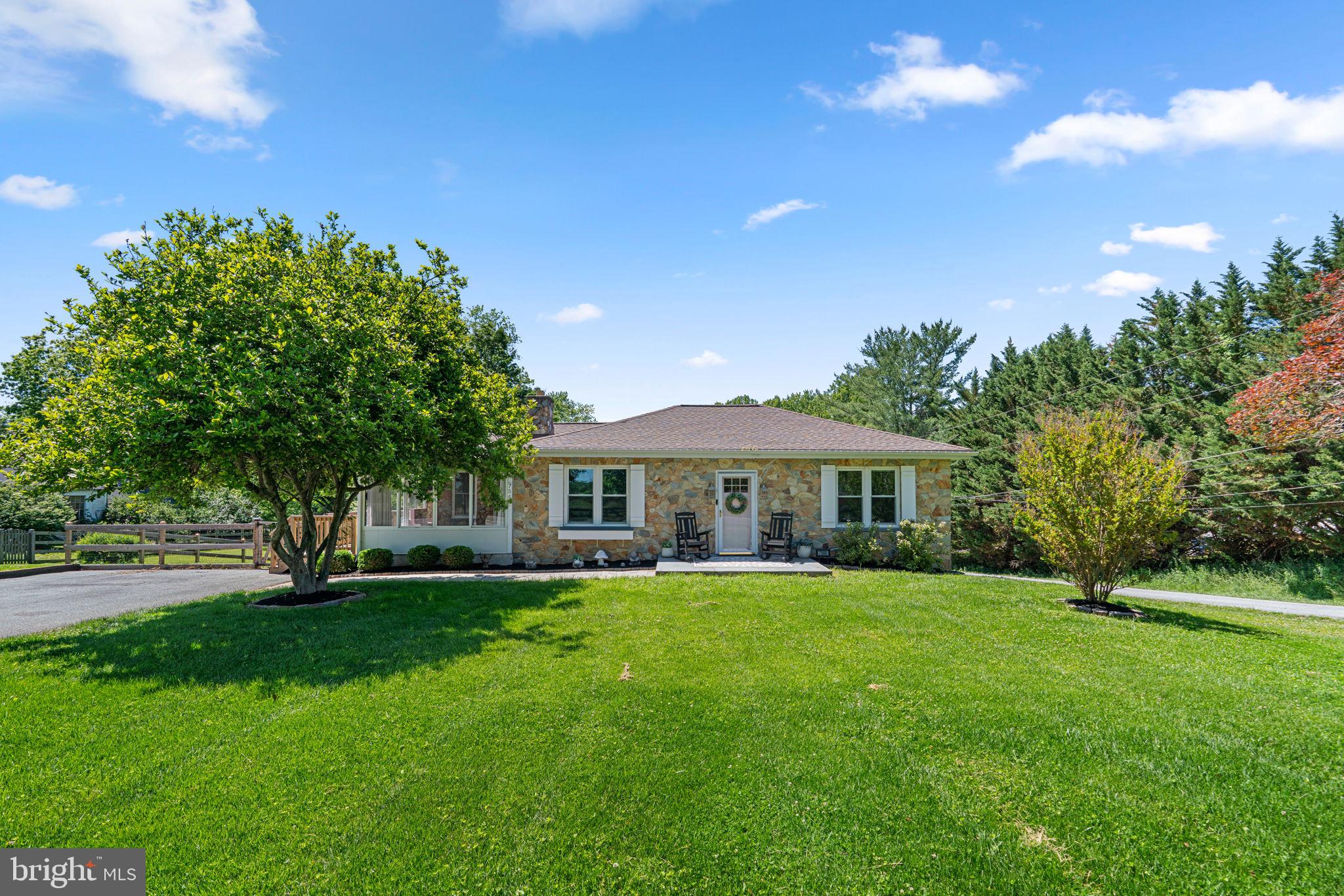 7546 Woodbine Rd | Offered at $495,000 Welcome to 7546 Woodbine Road, a beautifully updated stone-front rancher that perfectly blends timeless character with modern style. Completely remodeled in 2021 and thoughtfully enhanced by its current owners, this move-in ready home showcases exceptional pride of ownership and outstanding condition throughout. From the moment you arrive, you'll appreciate the home's striking curb appeal, charming enclosed front porch, mature landscaping, and classic stone exterior. Inside, rich dark wood flooring, stylish fixtures, and on-trend finishes create a warm and inviting atmosphere filled with character and charm. The spacious main level offers generously sized bedrooms, comfortable living spaces, and a beautifully updated kitchen and baths designed for today's lifestyle. The finished lower level adds tremendous flexibility with an additional bedroom, full bathroom, and abundant storage space; perfect for guests, a home office, recreation area, or multigenerational living. Step outside to enjoy the sizable, fully fenced rear yard featuring raised garden beds, plenty of room to play or entertain, and a massive storage shed for all your tools, hobbies, and outdoor equipment. Beyond its beauty, this home offers tremendous peace of mind with numerous recent updates and major capital improvements, including an architectural shingle roof, replacement windows (2020), HVAC system (2024), water heater (2024), kitchen appliances (2020), updated kitchen and bathroom flooring (2025-2026), new side porch (2024), fence (2024), well pump (2026), boiler system improvements including a new expansion tank and self-bleeding vents (2024 & 2026), and French drains installed on both sides of the home (2022 & 2025). Ideally located within the highly regarded southern Carroll County school district and offering convenient access to I-70 and other major commuter routes, this exceptional property combines quality, comfort, and convenience in one truly special package. Meticulously maintained, thoughtfully updated, and full of charm; 7546 Woodbine Road is ready to welcome you home.