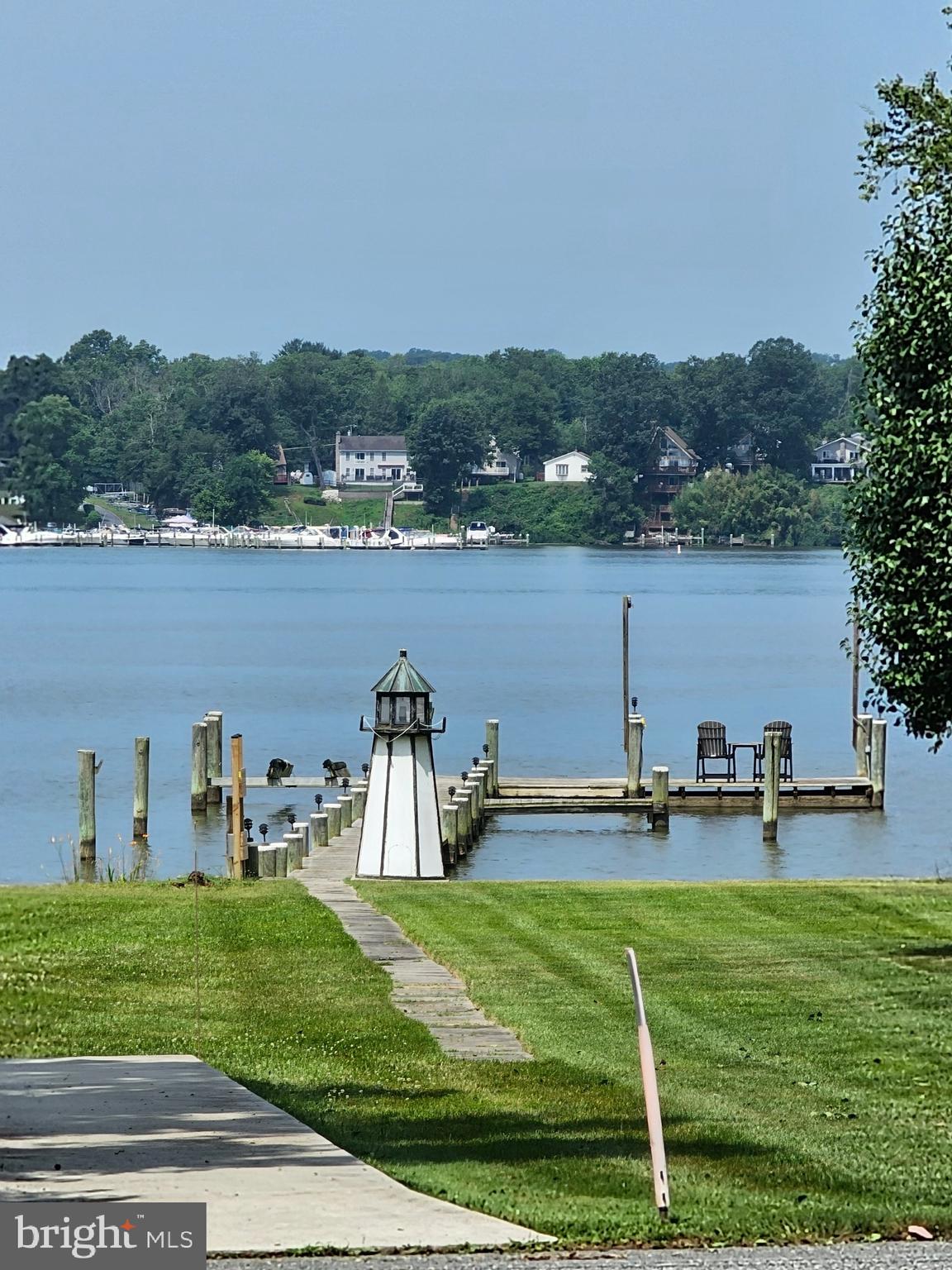 I am pleased to share an exceptional waterfront real estate opportunity featuring multiple parcels with incredible potential.
Parcel 185: Updated Ranch-Style Home & Garages
This parcel features a charming 2-bedroom, 1-bathroom ranch-style home with beautiful water views and a covered front porch.
Updated within the last five years, the home includes a new roof, water heater, LVP flooring, kitchen counters, and refreshed kitchen and bathroom backsplashes. Additional features include Anderson windows and a water softener system. For storage and hobbies, the property offers a detached, heated 24' x 28' two-car garage equipped with electric and water, plus an additional one-car garage.
Parcel 356: Wooded Buffer
This parcel consists of approximately 10,000 square feet of wooded, non-buildable land. It is part of the Harford County Land Trust, providing excellent privacy and protected natural surroundings.
Parcel 358: Buildable Waterfront with Private Pier
This buildable waterfront parcel totals approximately 0.21 acres and features a 175-foot private pier with direct water access, two boat slips, a boat lift, electric, and water. The pier has been recently upgraded with a new electrical box, new wiring, and 30-amp service. Additionally, a waterside parking pad is large enough to accommodate a fifth-wheel RV.
This versatile property package offers a unique combination of water views, premium boating amenities, buildable land, and protected natural surroundings—perfect for recreation, expansion, or year-round living.