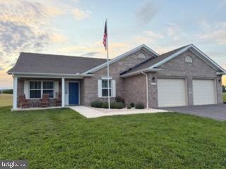 Coming Soon!    Beautiful brick rancher in a peaceful country setting located between Hagerstown and Clear Spring.  This well built home is all brick and has architectural shingles and sits on a large level 1.03 acre lot!  The ease and convenience of all one level living it is also great for entertaining.  The main area is open to the living room, dining area and kitchen.   High ceilings, sun filled rooms and stunning sunset views (see photos)!  3 bedrooms and 2 full baths.  The primary bedroom has a walk in closet and private bathroom with a walk in shower.   The attached 2 car garage includes a 120-volt hookup.   This almost new home is just over 1 year old and has all the updated features of newer homes including a sprinkler system, water filter system and a roomy laundry room.   Great opportunity  to own this  lovely home in the country.