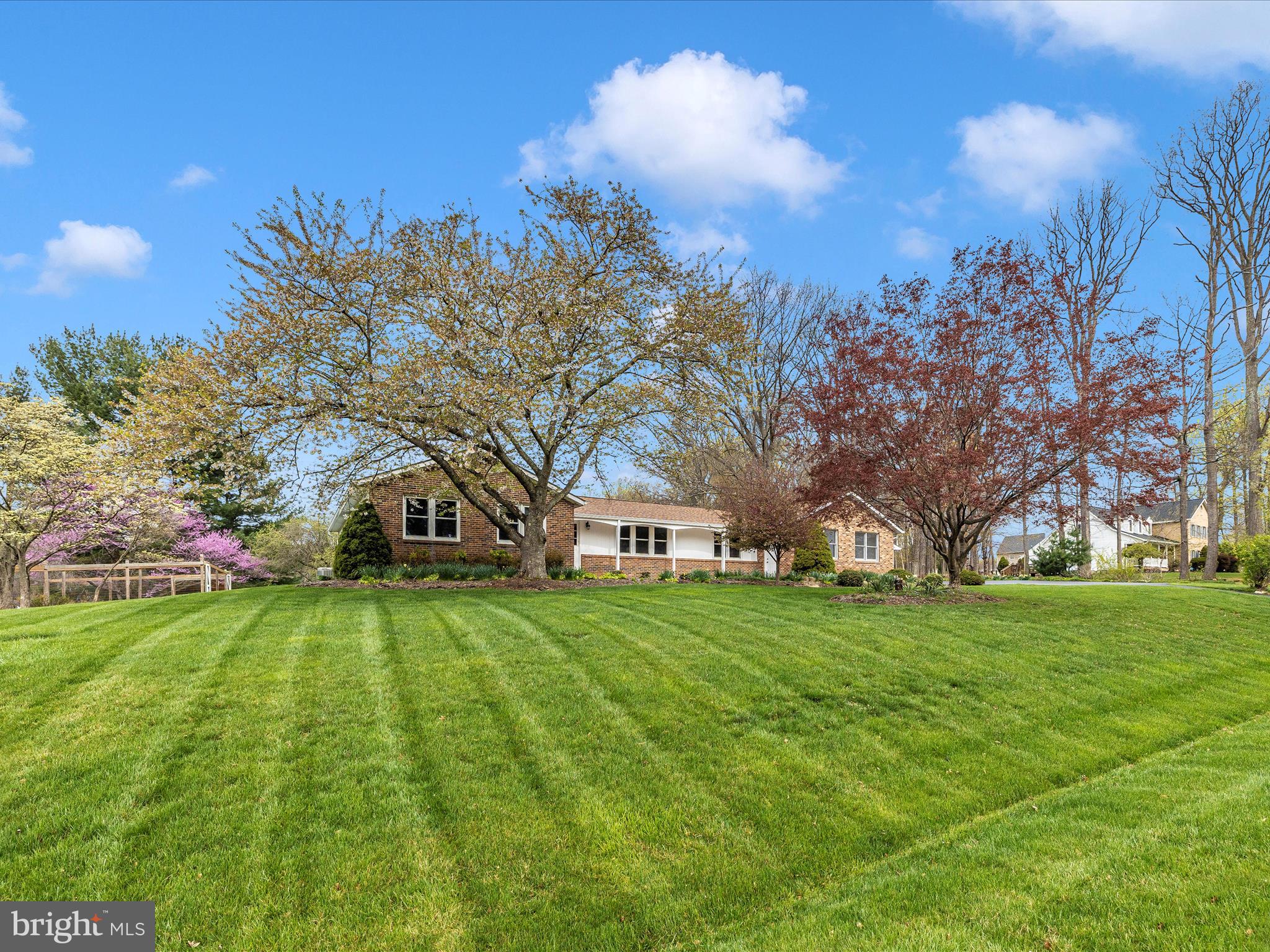 Amazing farmette!  Bring your horses and your chickens! The barn and chicken coop are awaiting your arrival!  The barn is complete with 3 stalls, a tack room, loft and run-in area. The pasture is fenced with 4 board fencing and includes the ease of an automatic waterer.  Enjoy sitting on your low maintenance Trex deck watching your horses graze while listening to the babbling of water down the aquascape waterfall as it meanders into the decorative pond.  Be amazed this spring as the gardens come to life full of flowering perennials! Plant your vegetable and fruit garden in the enclosed area protected from nature's visitors.  The interior of the home has been as carefully maintained and cared for as the exterior.  One level living at it's best!  The country kitchen is the center of this home with a large island, eat in area and wood stove with brick accent wall. Corian counter tops, solid Cherry cabinets and hardwood floors make this kitchen special. The sliding glass doors bathe the kitchen with light and provide a fantastic view of the garden and farm. The large family room is cozy with a wood stove insert yet impressive with a cathedral ceiling and large windows on either side of the stone hearth.  The formal dining room and living room are wonderful options for a larger gathering of friends and family. From the large master bedroom, you will again have a wonderful view of the farm. Imagine waking up every morning and getting to see your horses right outside your window! Three other bedrooms compliment the home.  There is plenty of storage with the 2 car attached garage and over-sized 2 car detached garage. The windows have been replaced, the asphalt driveway is new, and the roof is only 12 years into a 40-year shingle.