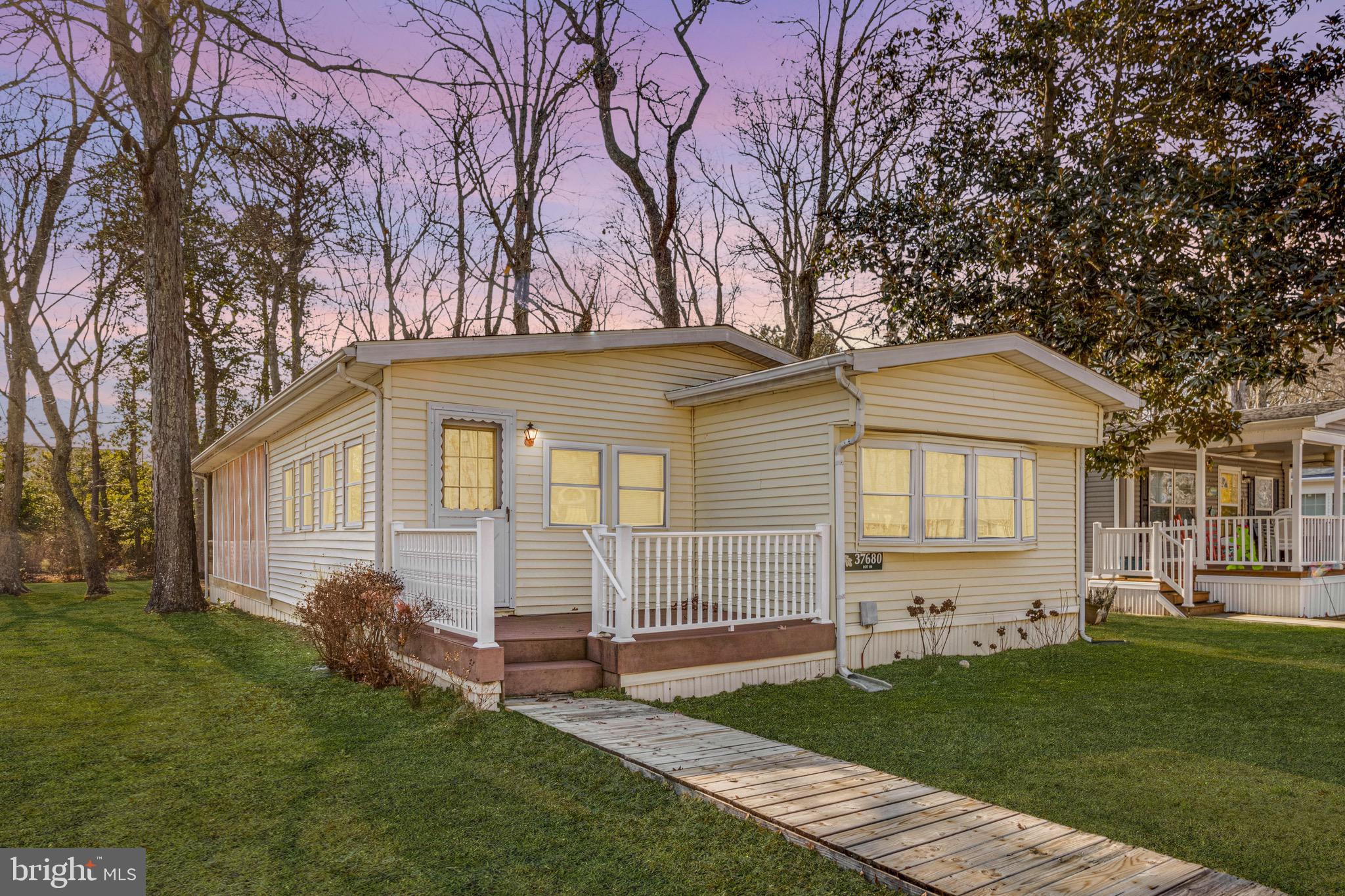 Back on the market at no fault of the seller. 
Charming 2-bedroom, 1-bathroom home in the Shady Park community, just minutes from Fenwick Island. This well-maintained home offers a comfortable living room, a cozy den for extra gathering space, and a kitchen with a dining area. Enjoy coastal living with a screened porch and an outdoor shower—perfect for rinsing off after a day at the beach. Additional storage for all your beach needs is available in the backyard shed. Whether you're looking for a summer getaway or a year-round residence, this home provides a fantastic location and a relaxed lifestyle near shopping, dining, and the shore. Don’t miss the opportunity to schedule a private tour!