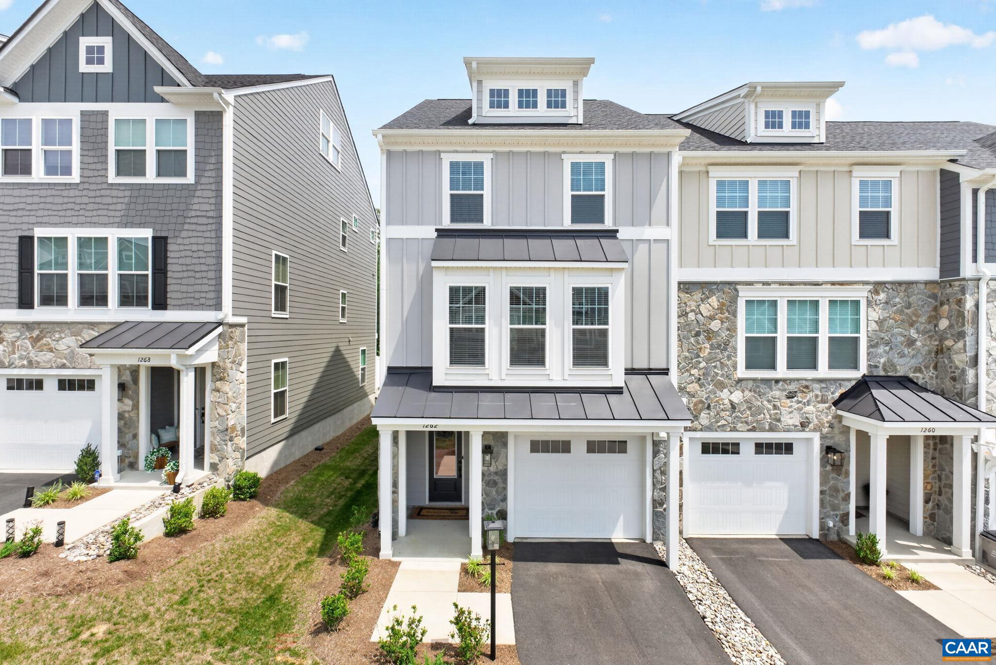 This light-filled end-unit townhome in Brookhill offers the perfect blend of modern comfort, flexible space, and neighborhood convenience. Built in 2023, the home features three finished levels with 4 bedrooms and 3.5 baths. An ideal and spacious layout for everyday living, guests, or flexible living spaces such as a home office or exercise room.  The main level is open and inviting, with the family room, kitchen, and dining area flowing seamlessly together. Step outside to the back deck for easy outdoor living, whether you are enjoying coffee, grilling, or unwinding after the day. LVP floors anchor the main living spaces, while the bedrooms offer soft carpeting for added comfort. The primary suite features double sink vanity, spacious tiled shower and a walk-in closet.  Brookhill offers wonderful community amenities including several playgrounds with the main one right across from this home, fire pit, and basketball court, all in a convenient Charlottesville location close to Target shopping center & dining.,Granite Counter,Maple Cabinets,Painted Cabinets,White Cabinets