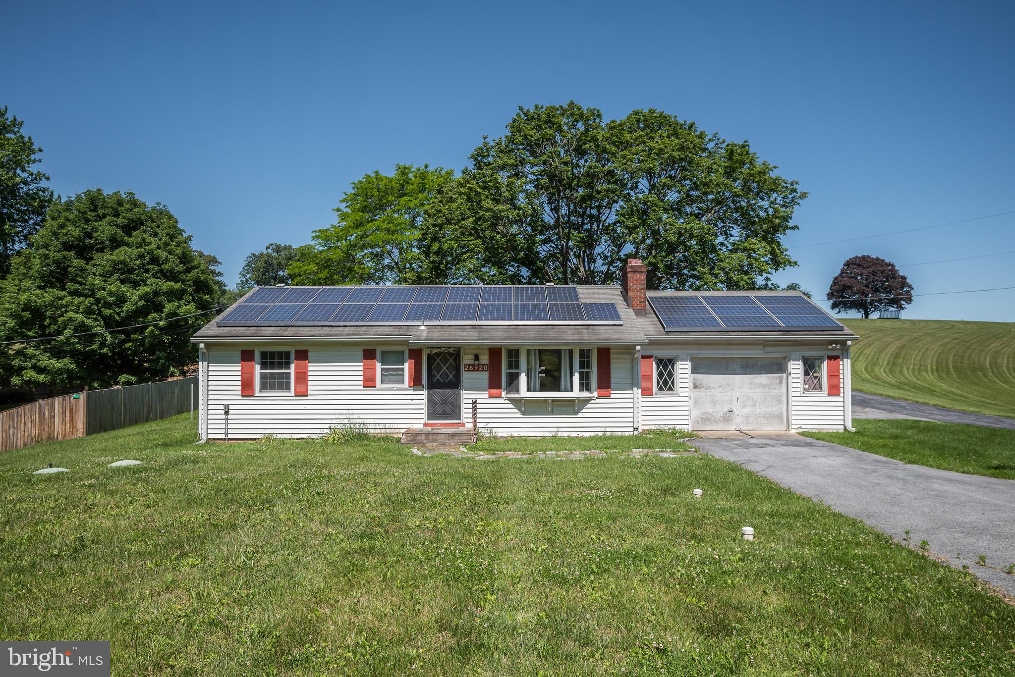 Amazing opportunity to live in a nice house, and a great business potential.  Lovely and cute ranch house with a family room addition.  Lots of updates, and a few more to go.  But the real star of the property is the amazing yard, with a country farm feel, and a huge two-story barn that offers income-producing rent from lower level automobile facility, a greenhouse on the side, and a music and video recording studio on upper level.  Upper level has private entrance, full bathroom, bedroom, electronics room, singing studio, mixing room! Circular driveway, side parking pad, and a parking lot for another 15 cars.  Car enthusiasts and auto mechanics can work inside all year long.  Garage has heat and a/c, and can accommodate 4 cars inside.  Make a business, grow your business, help your business, in the privacy of your own home!