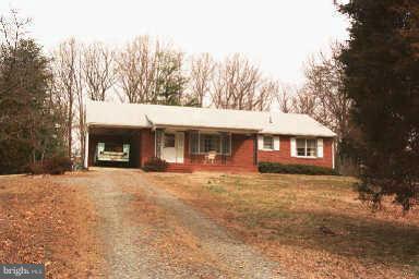 Brick rambler features a *rare* primary home and investment (subdivision) opportunity! No HOA, so bring your camper, boat, RV, and trucks!  Situated on 2.3 acres, this home includes 3 beds, 1.5 baths, an attached carport, and a powered Butler building on concrete slab, with roll-up door, great for a detached car garage, storage, and/or work shop!  The kitchen includes table space, multi-burner cooktop, range hood, built-in wall oven, refrigerator with freezer, dual-tub/split sink, tile backsplash, and plenty of cabinets. The home also features central air conditioning, a multi-zone heating system (with separate thermostats), separate laundry/storage room, washer/dryer, wood flooring, and spacious closets throughout. Enjoy the front porch, outdoor spaces, and surrounding yard, perfect for entertaining or relaxing! Located in booming Stafford, on 2 parcels (109 & 109A sold together), this property includes a long gravel driveway, providing lots of parking and privacy.  Creation of a 2-3 home subdivision possible. Inquire with listing agent for more detail. Welcome home to your primary residence and/or possible next investment! New professional photos coming soon!