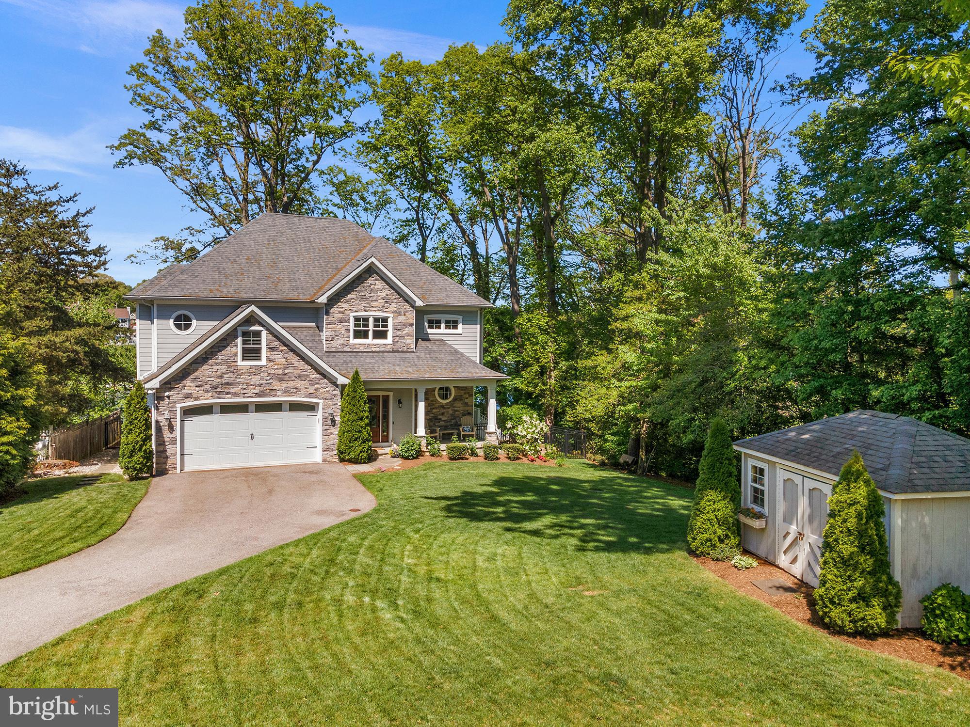 All offers due by 4pm today.
Rare opportunity to own a truly unique custom-built waterfront home in the desirable Arden on the Severn community. Built new in 2016–2017, this thoughtfully designed home offers the perfect combination of luxury, comfort, efficiency, and waterfront lifestyle.
Set on deep water with a private beach area, pier access, and boat lift accommodations, this property is built for year-round enjoyment on the water. Whether you are boating, paddle boarding, relaxing by the fire pit, or enjoying the private beach area, this home offers an incredible outdoor living experience. The walkable private Arden beach provides access to a playground, grills, beach volleyball court, and boat ramp, while the neighborhood also offers nearby soccer fields, baseball fields, and additional playgrounds.
Inside, the home features tall 10-foot ceilings, hardwood floors throughout, crown molding, built-in bookcases, custom bench seating with hidden storage, and a warm gas fireplace. The living room and backyard are equipped with Bose surround sound speakers, creating an ideal setup for entertaining both indoors and out. The kitchen and main living areas flow beautifully, offering an open, custom feel throughout the home.
All full bathrooms include heated floors, and the primary bathroom features vaulted ceilings for an added touch of luxury. Two bedrooms include custom California Closets, and the home also includes a mudroom with a dog bath, tile flooring in the full bathrooms and mudroom/laundry area, and smart storage details throughout.
Built with efficiency and peace of mind in mind, the home includes a geothermal system located in the crawl space, a temperature-controlled concrete-floor crawl space extending beneath the full footprint of the home, an in-home fire sprinkler system, a security system with interior alarm and exterior cameras monitored by Alert 360, and a 2017 Hoot septic system.
Additional features include a large two-car garage with extra storage space, multiple sheds including one near the water, an in-ground sprinkler system, and an outdoor propane-connected fire pit.
This is more than just a home — it is a custom waterfront retreat offering deep-water access, private outdoor spaces, community amenities, and high-end features throughout.