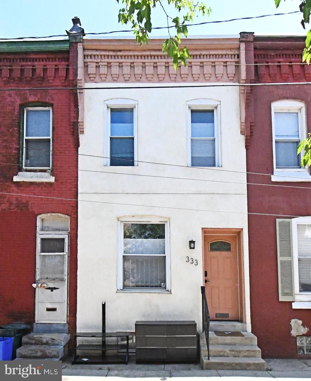 Welcome to 333 N Holly Street! A charming 2-bedroom, 1.5-bath home tucked away on a quiet street in the heart of University City. From the moment you step inside, you’ll appreciate the warm character throughout, highlighted by beautiful hardwood floors, fresh interior paint, and exposed brick accent walls in both the living room and powder room.

The open-concept living and dining areas flow seamlessly into the kitchen, creating an inviting layout ideal for both everyday living and entertaining. Just beyond the convenient first-floor powder room, the rear door leads to a private fenced-in patio. A perfect place for relaxing, grilling, or enjoying your morning coffee.

Upstairs, you’ll find two spacious bedrooms with generous closet space, along with a full hall bathroom. Recent updates include a newer water heater (2024) and roof (2025) with a 10 year warranty, providing added value and peace of mind.

Ideally located with quick access to I-76 and the Market-Frankford Line, this home is just minutes from Drexel University, UPenn, Penn Presbyterian Medical Center, CHOP, and all that University City has to offer. Whether you’re a professional, student, or investor, this home is a fantastic opportunity to enjoy convenient city living in a prime location. Schedule your showing today!