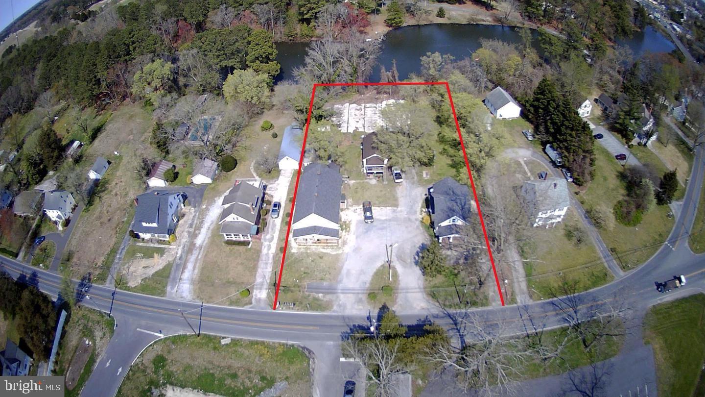 **Prime Development Opportunity With Rare Waterfront Potential!**
These two parcels-28646 and 28650-totaling 1.15 acres, consist of 8 units and are in the final phase of annexation into the city of Salisbury. Once complete, you’ll gain access to public water and sewer along with zoning that allows up to 12 units per acre, opening the door to a wide range of possibilities.

28650 currently has a single family home with 28646 having two multifamily properties.   Please note, not all units are currently rented or rentable.  

Whether you envision a standout single-family residence with expansive grounds, a collection of premium townhomes, or high-demand multifamily buildings to capitalize on Salisbury’s strong rental market, this property offers the flexibility to bring your vision to life. Preliminary concepts for 12 townhomes have already been drafted, and additional layouts, plats, and plans are available upon request.

With direct frontage on a tranquil lake, the site is ideally suited for a true waterfront community—perfect for creating desirable living spaces with natural views and outdoor amenities.

The property is currently improved with 8 units and is professionally managed.