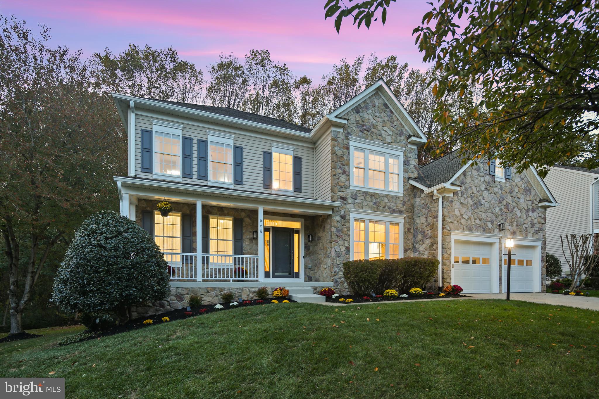 Magnificent Luxury Home in the Heart of River Hill!
Nestled on a peaceful cul-de-sac, this extraordinary residence perfectly balances refined elegance, thoughtful updates, and a rare natural setting. Situated on a picturesque 0.4-acre lot backing to forest conservation, home enjoys a high elevation with breathtaking views of mature trees, lush green lawns, and vibrant flowering gardens.
A charming stone-accented façade, wide front porch, and new high end entry doors set a grand first impression, welcoming you into approximately  5,000 sqft of beautiful living space.
Step inside to a dramatic two-story foyer, flanked by formal living and dining rooms with exquisite light fixtures- setting the tone for the home’s sophisticated interiors.
The private rear office features double French doors, large windows, and amazing views of the surrounding landscape—ideal for work-from-home.
A stunning, brand-new chef’s kitchen showcases soft-close white shaker cabinetry, an expansive waterfall island with added cabinets and built-in microwave, designer pendants, premium quartz countertops, and a striking glass tile backsplash. A vented hood over gas range elevates the culinary experience, while the bar area flows effortlessly into a sun-drenched morning room—perfect for daily enjoyment and entertaining family and friends.
Just beyond, the soaring two-story family room is bathed in natural light through new skylights and walls of windows, offering panoramic views of the backyard. Rich hardwood floors span the main level, and a new composite deck extends the living space outdoors, creating a seamless indoor-outdoor retreat.
Upstairs, you’ll find 4 spacious bedrooms and 3 fully renovated bathrooms. The luxury primary suite boasts tray ceilings, a massive walk-in closet, and a sitting area with window walls for serene woodland views. The spa-inspired ensuite is beautifully appointed with a jetted soaking tub, frameless glass shower, and a dual-sink vanity. Two additional hall and guest bathrooms have been updated with walk-in showers and modern finishes.
The fully finished walkout basement adds exceptional versatility, offering a 5th bedroom, a flex room, updated full bath, home gym, expansive recreation space, and oversized storage. New high quality lux LVP flooring  throughout.  
Outdoor living is equally impressive with extensive hardscape, including a retaining wall, oversized paver patios, flower beds—all designed to create a stunning, low-maintenance outdoor oasis. The property line is set deep in the woods.
Updates also include:
fresh interior and exterior paint,
new hardware and designer lighting throughout,
whole-house CAT6 cabling and professional networking setup,
custom closet systems with organizers on all three levels,
roof, Carrier HVAC, water softener, and water heater all recently replaced.
This turn-key luxury home is better than new.  Prime location—just moments from scenic trails, top-rated River Hill schools, fitness centers, pools, shopping, dining, and major commuter routes (32/29/95) for easy access to Baltimore, Washington, D.C., Rockville, and Annapolis. 
Welcome home to the best of River Hill living—where timeless elegance meets modern comfort.