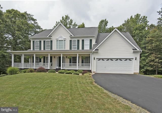 Impressive Home with Many Updates Landscaped Corner 1.12 Acre Lot PLUS Adjacent 1.41Wooded Utility Lot 3 Finished Levels Hardwood Floors Detailed Molding Thru-Out Gourmet Kitchen w/ Stainless Appl&Granite Amazing Master Suite w/ Separate Sitting Room&Enormous Walk-in Closet Fin. Rec Room w/ Full Bath in Basement Wrap Around Front Porch with 2 Decks Sprinkler System NO HOA Move-In Ready!