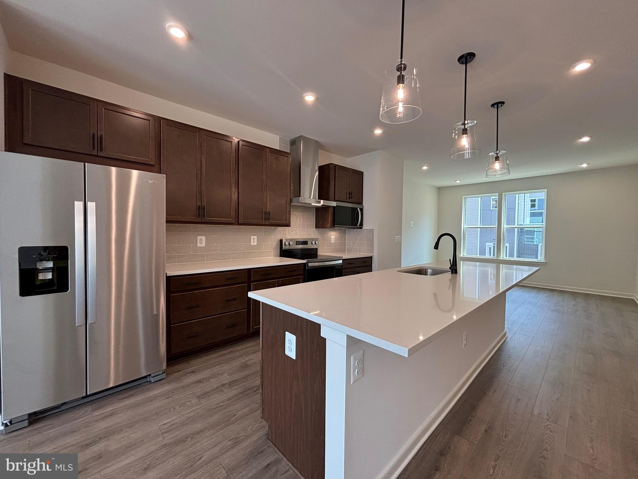 *NEW CONSTRUCTION* Special All-In Price, for Immediate Move-In! Receive up to 3.99% 5/1 ARM [5.94% APR] FHA & VA Rate with Choice Lender on Quick Move-In Homes!* Monthly payments are made easier during Beazer Friends & Family Sales Event until 7/31. Hometown heroes get $5,000 until 7/31 (restrictions apply; see New Home Counselor for details). Step into the Potomac, a superior 3-level townhome with a 2-car garage in the sought-after Cascade Landing community in Dumfries, VA. This thoughtfully designed home offers 3 bedrooms and 3.5 baths, all with 9 ft. ceilings for an open, airy feel. The gourmet kitchen is a showpiece, featuring upgraded Fairfield Truffle brown cabinets, quartz countertops, ceramic tile backsplash, range hood, and stainless-steel Whirlpool appliances. Designer laminate flooring flows throughout the main level, including the kitchen, walk-in pantry, dining room and great room. The luxurious primary suite includes a generous walk-in closet and a spa-inspired bathroom with raised double vanities, quartz countertops, and a shower with designer ceramic tile. Plus, the garage includes an EV charger-compatible outlet, making this home future-ready. Enjoy low-maintenance living with affordable HOA dues (no hidden developer fees) so you can put your savings toward what matters most. Cascade Landing offers a welcoming neighborhood with a playground, easy walkability, and quick access to premier parks and trails. These advanced performance homes save you money on utilities while reducing your carbon footprint. Located just 2 miles from Marine Corps Base Quantico (North Gate) and 2.5 miles from I-95, commuting is effortless. Photos of similar home. Plus, you’re close to Fortuna Center Plaza, Locust Shade Park, and dining favorites and entertainment. Model Home Hours: Mon–Sun, 11 AM–6 PM. Use 17910 Alicia Avenue, Dumfries, VA 22026 for GPS directions. Please go to the model home listed here first. Photos of actual home.
