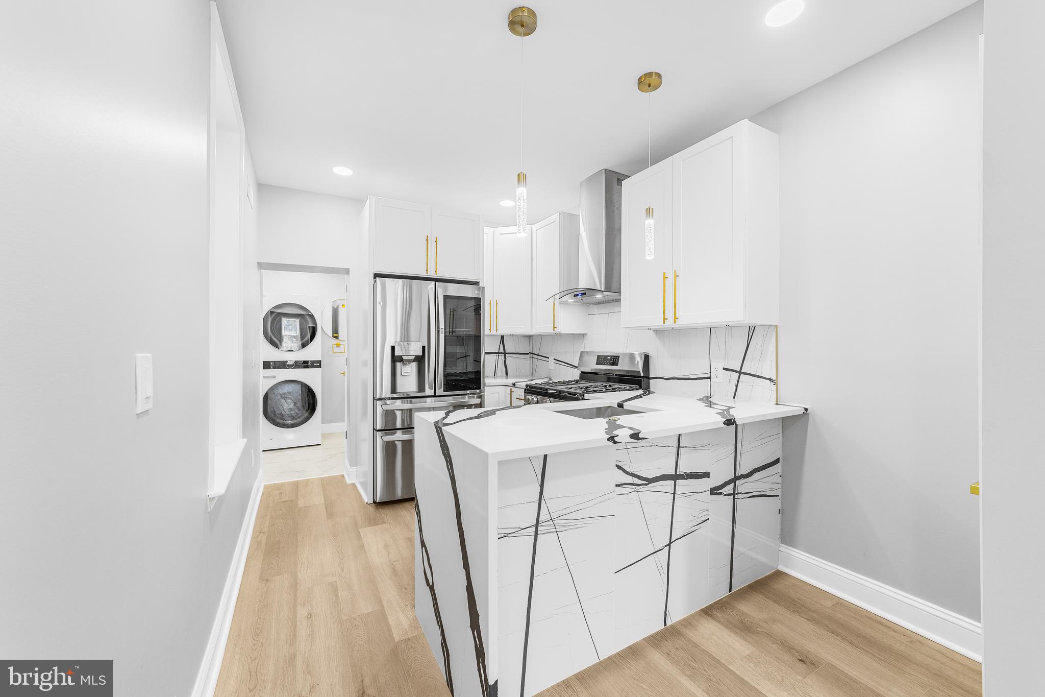Back on the market and ready to go for Spring! Absolute convenience can be had at this traditional brick Row/Townhome in the Lower NE Philly Neighborhood of Frankford! Just a short walk to the El Train to get to Center City, a short drive to I95 or Route 1, to get you to anywhere you need to go! There are stores galore on the Frankford Avenue shopping corridor too! This home is turnkey, just walk inside, pickup your jaw off the floor, and then take your tour. From the fully open floor plan, wood flooring, recessed lights, wrought iron railings, and fresh bright paint, to the gorgeous peninsula style Kitchen granite countertops, soft-close cabinetry, stainless steel dishwasher, gas range/oven, exhaust hood, and refrigerator, to the rear laundry and beautiful Bathroom with glass door stall shower, and exit to the low maintenance cement rear yard, fully wood fenced, including a Central Air condenser. The lower level is a huge storage space with a new gas hot air furnace and gas hot water tank, and you could finish this versitile space off to be your personal gym, gameroom, or whatever you want. The upper level accommodates with 3 Bedrooms and a posh Bathroom that includes a tub/show combo with glass sliding doors, and a dual floating vanity with LED lit mirror. Please take a minute to view the Video Tour and then schedule your in-person showing appointment, today! Some photos have been Virtually Staged/Enhanced.