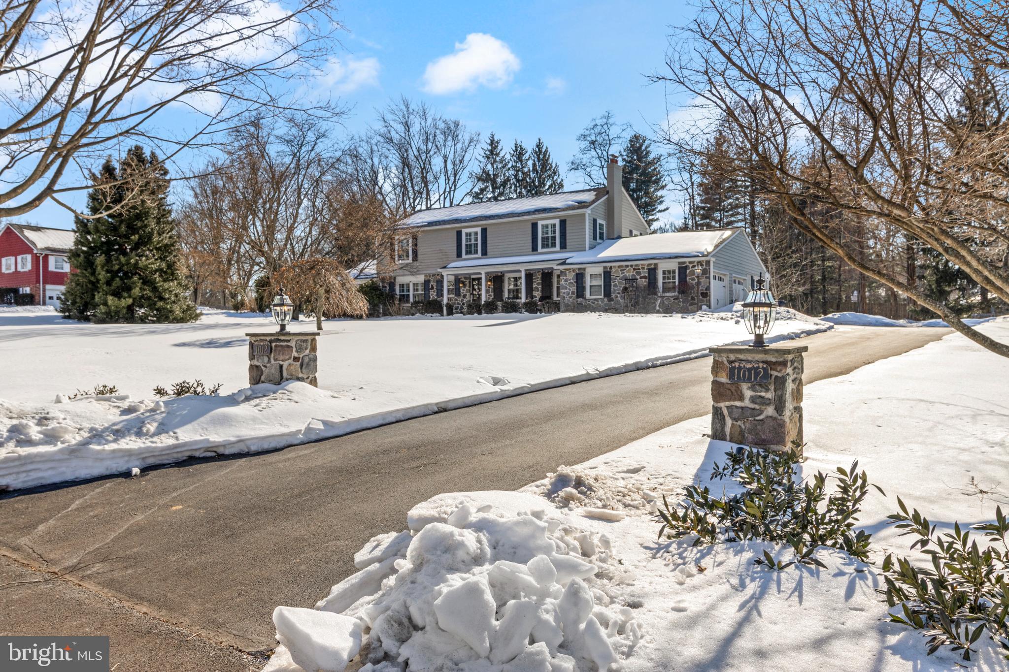 Set on a flat, level lot on a quiet street in a premier Berwyn location, this updated four bedroom colonial combines modern sophistication with a functional layout and offers the perfect balance of style and everyday comfort. Step inside to find an open, light-filled interior featuring premium finishes, solid oak wide plank wood flooring, and thoughtful upgrades throughout.
The entrance is complete with a limestone walkway which extends to the charming front porch. Enter the stylish foyer which is flanked by the spacious family room and elegant dining room. 
The dining room features a white brick fireplace with built-in shelving and plenty of space to entertain. The family room boasts impressive open living space, double door access to expansive backyard, custom plantation shutters and is the perfect place for any gathering.The custom, gourmet kitchen is a show stopper. Offering an extra large 11 ft island with a single slab of custom granite, honed granite countertops, subzero and thermador appliances, custom cabinetry, butler’s area with wine refrigerator, restaurant quality ice maker, and double beverage drawers. The breakfast area offers beautiful views through the sliders that lead to the large rear yard. Completing the first floor is an updated half bath, mudroom with garage access and a laundry room/office space.The half bath features a live edge vanity top, tile wall and wall mounted plumbing. The large laundry area is conveniently located complete with built in desk/office space and heated flooring. The lower level is finished and offers the perfect flexible space with new LVP flooring. The second floor offers a primary bedroom with a completely renovated bath and closet, 3 additional bedrooms with closet systems and an updated hall bath. The primary closet and bath provides organization and spa like luxury. The impressive backyard offers a paver patio with seating wall, pillars and side patio with accent lighting and built-in speakers, a rear fire pit area with paver pit and mulched dedicated bed, as well as multiple gardens with flowers, fruits and vegetables. This exceptional property is a rare find in a coveted area that perfectly positions privacy and convenience and just moments from upscale shopping, dining, private schools and exclusive private golf clubs.