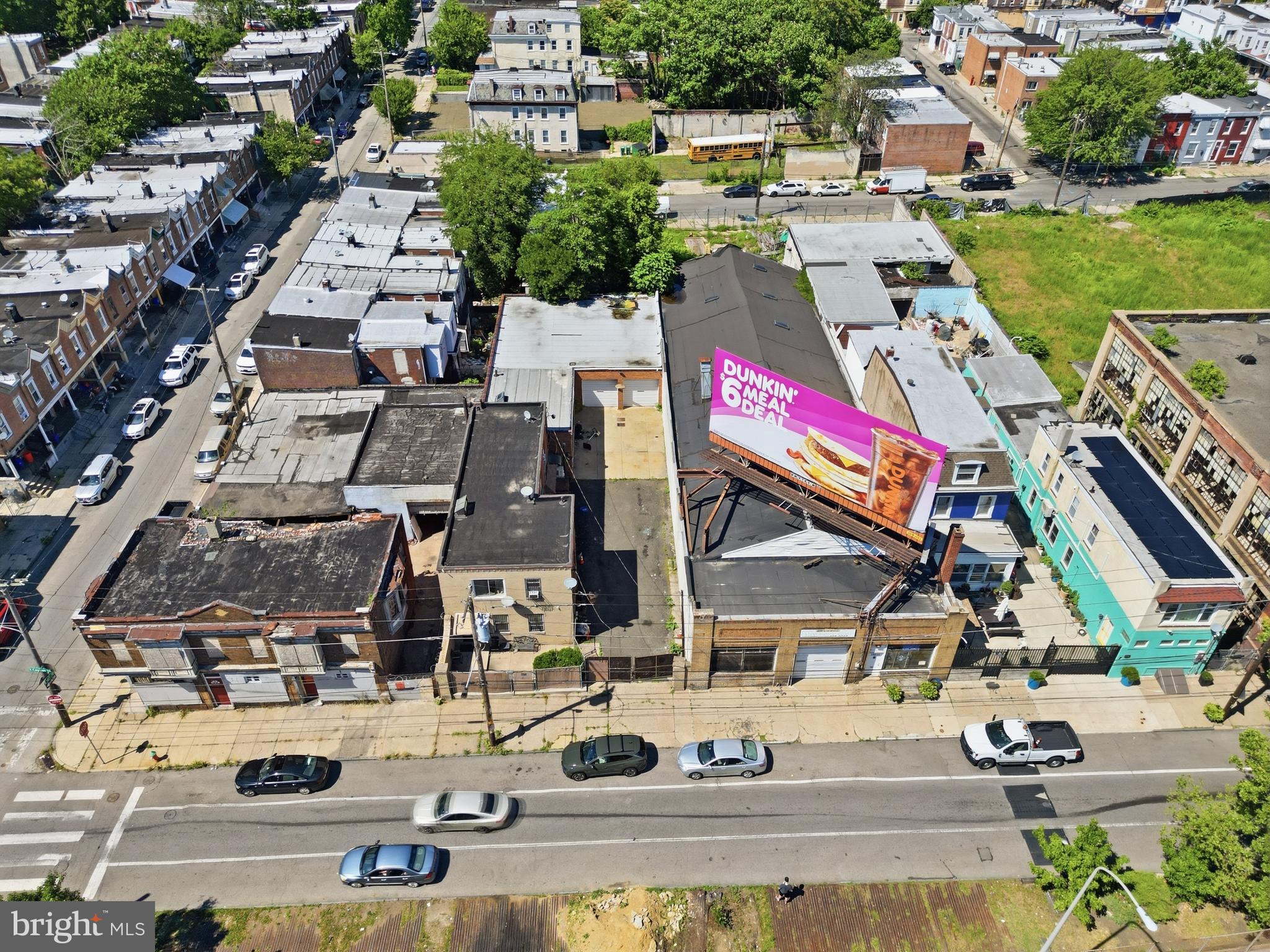 ***Mixed-Use Contractor Yard & Income Property – Garage, Offices, Apartments & Secure Storage***

Exceptional mixed-use investment and owner-operator opportunity in the rapidly developing Hunting Park/Nicetown section of Philadelphia! Situated on a sizable parcel, 1725-27 W Cayuga Street offers a unique combination of income-producing residential units, functional commercial space, and a large secured contractor's yard that is nearly impossible to find within Philadelphia city limits.

The commercial portion of the property is ideally suited for contractors, landscapers, tradesmen, transportation companies, storage users, or investors seeking a versatile asset. Features include an oversized garage with two 10-foot bay doors, 12-foot ceilings, a loading dock, four secured storage rooms/areas, a full basement utility and storage area, and two large office suites with bathrooms. These office spaces provide excellent operational flexibility and could potentially be converted into two additional residential units, subject to any required approvals.

Outside, the expansive secured yard offers tremendous value with abundant space for equipment storage, materials, fleet vehicles, trailers, machinery, and contractor operations. Opportunities to acquire a property with this level of outdoor storage and parking capacity within the city are extremely rare.

The residential component consists of three separate apartments providing immediate and future income potential. The second-floor two-bedroom, one-bath apartment features a spacious living room, kitchen, and bathroom and is occupied by a long-term month-to-month tenant paying $850 per month plus utilities. An additional one-bedroom, one-bath apartment is also occupied by a long-term month-to-month tenant paying $850 per month plus utilities. The first-floor one-bedroom apartment is currently vacant and consists of a living room, kitchen, bedroom, and bathroom, offering immediate leasing potential with projected rents of approximately $850-$900 per month. Two-bedroom units in the area command rents of approximately $1,200 per month, providing additional upside potential.

Conveniently located with easy access to Center City Philadelphia, Temple University Hospital, Broad Street, Roosevelt Boulevard, Interstate 95, Route 1, and the Pennsylvania Turnpike, this property offers exceptional connectivity to both the city and surrounding suburbs. Public transportation, shopping, dining, schools, and employment centers are all nearby, making this an attractive location for both residential tenants and business operators.

Whether you're seeking a headquarters for your contracting business, a live-work opportunity, additional storage and operational space, or a value-add investment with multiple income streams and future expansion potential, 1725-27 W Cayuga Street presents endless possibilities. A truly one-of-a-kind commercial and residential property offering flexibility, income, and long-term growth potential.